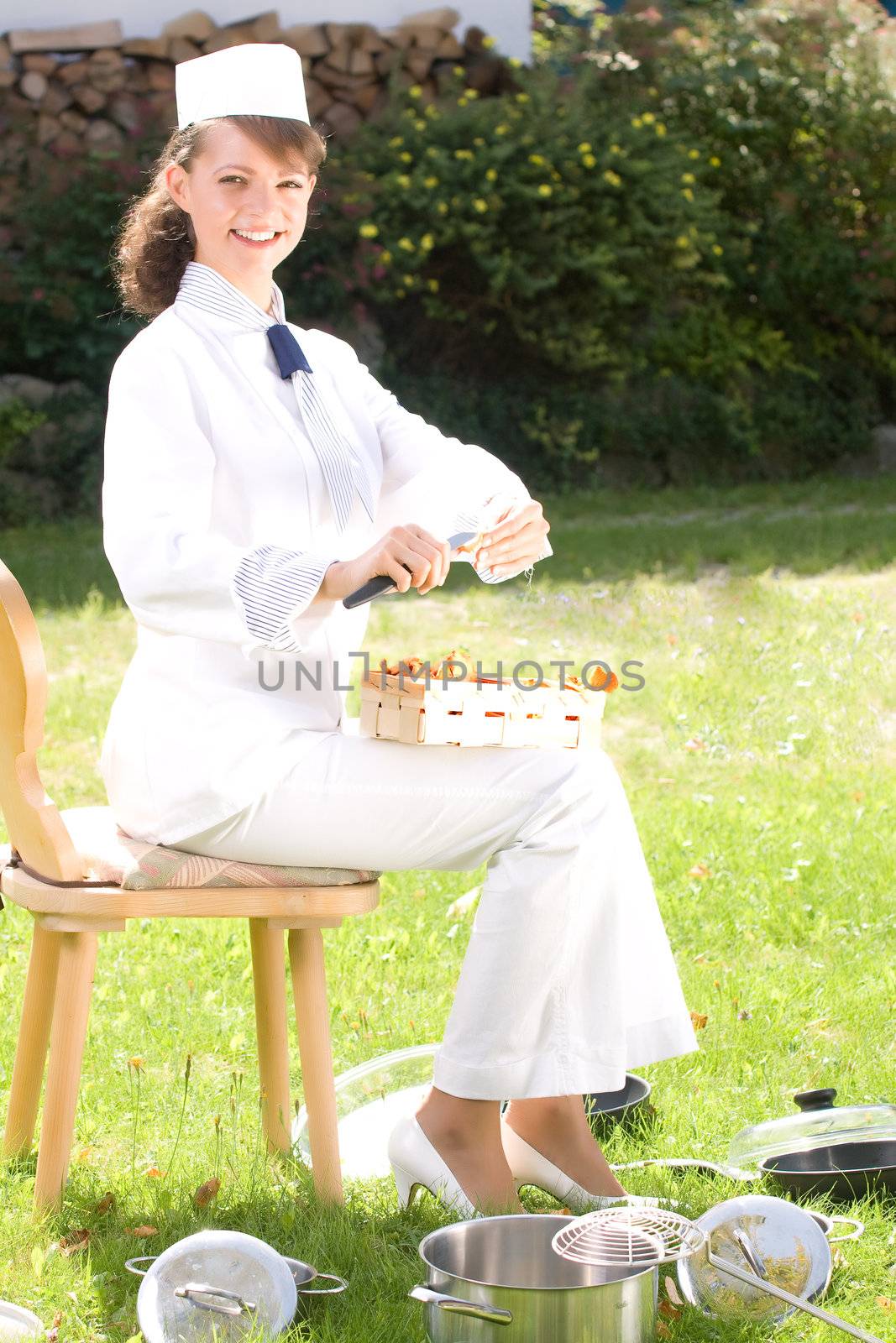 female chef with chanterelle mushrooms, by STphotography