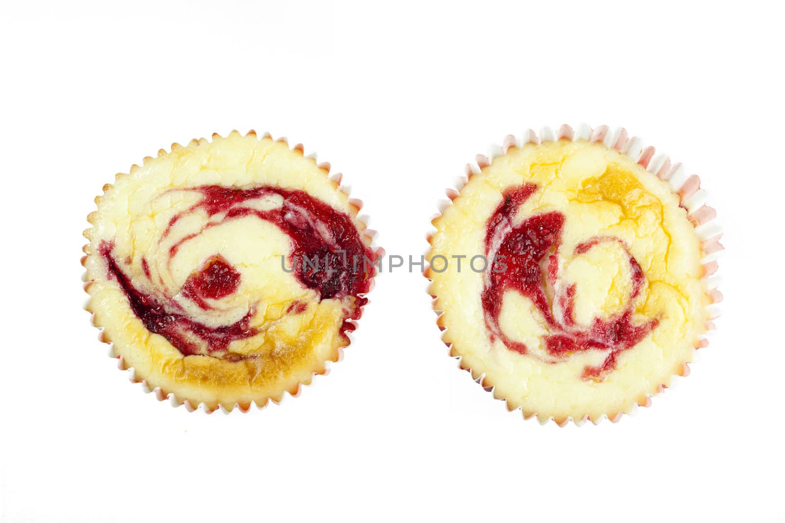 Muffine sized cheesecakes isolated on white and viewed from directly above.