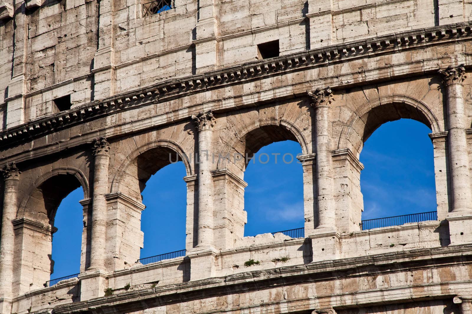Colosseum in Rome with blue sky, landmark of the city