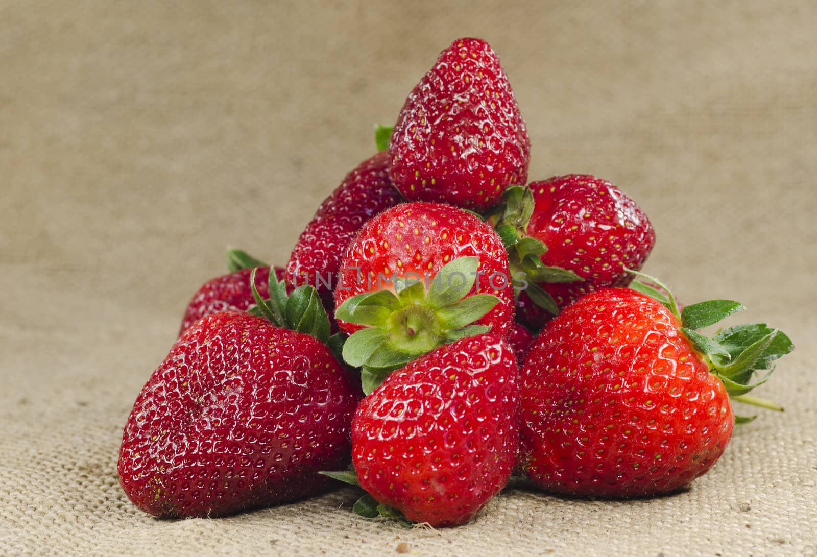 lot of strawberries on burlap