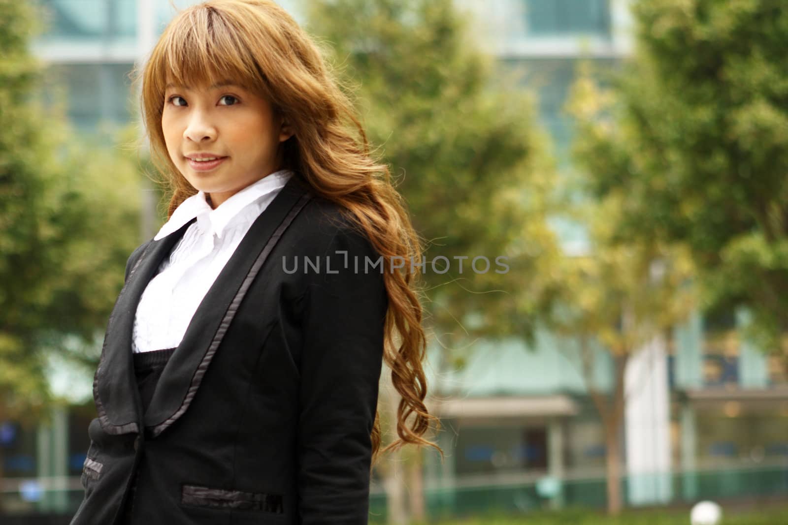 pretty asian business woman at office building 