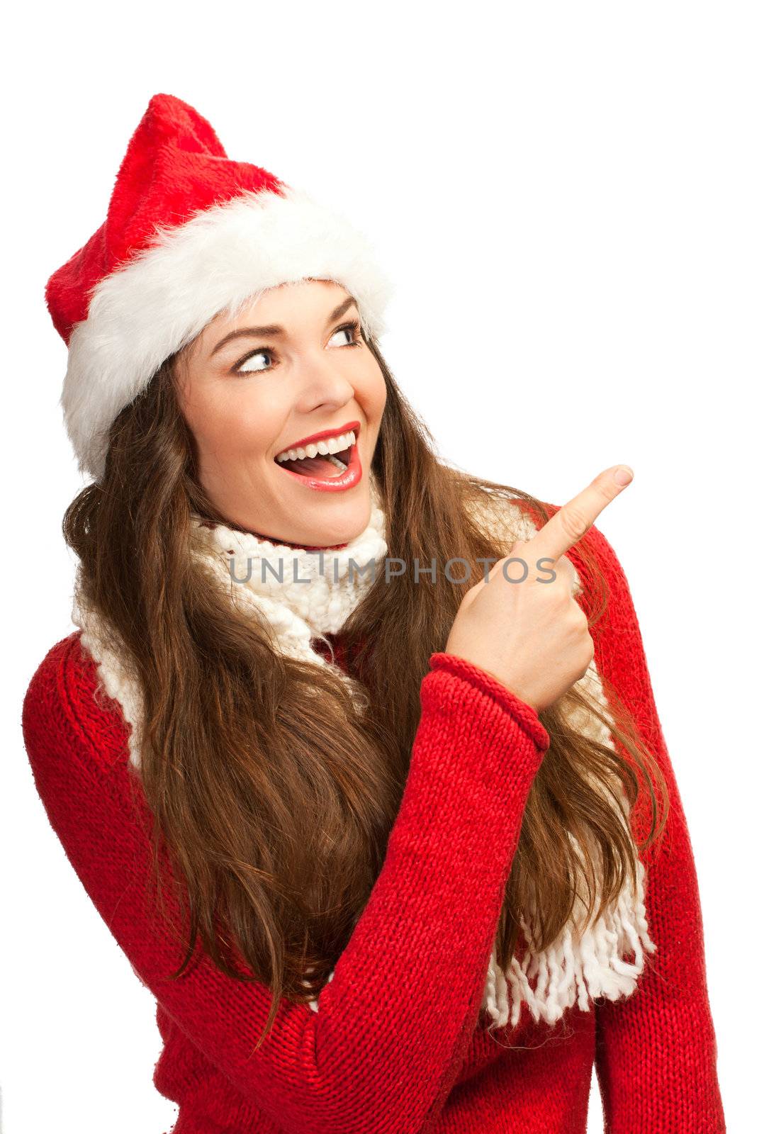 Woman in santa hat pointing to copyspace by Jaykayl