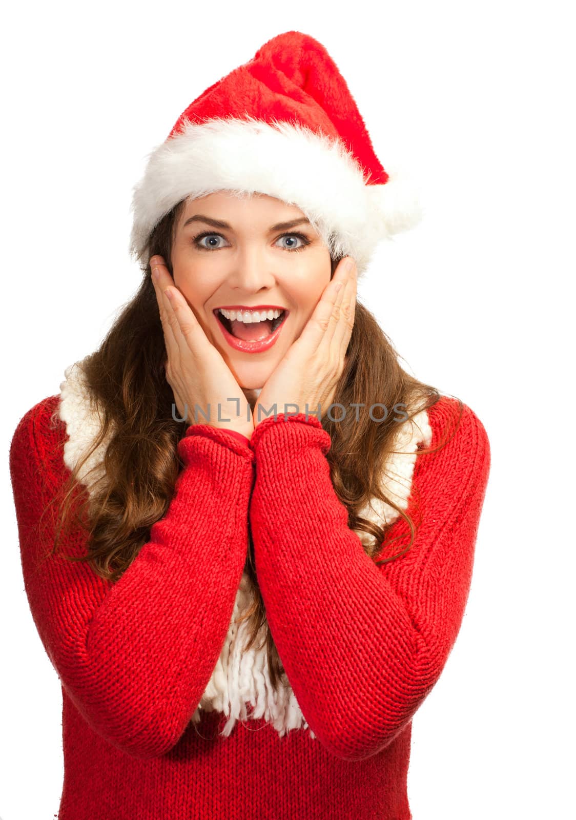 A surprised beautiful young woman in a santa hat. ISolated on white.