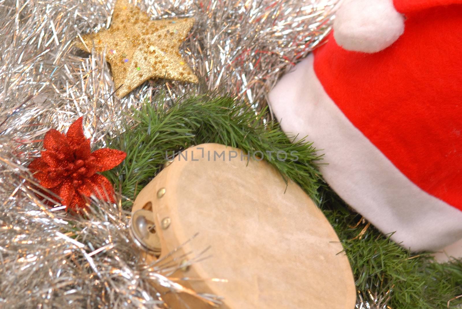 santa claus hat, tambourine and Christmas decorations