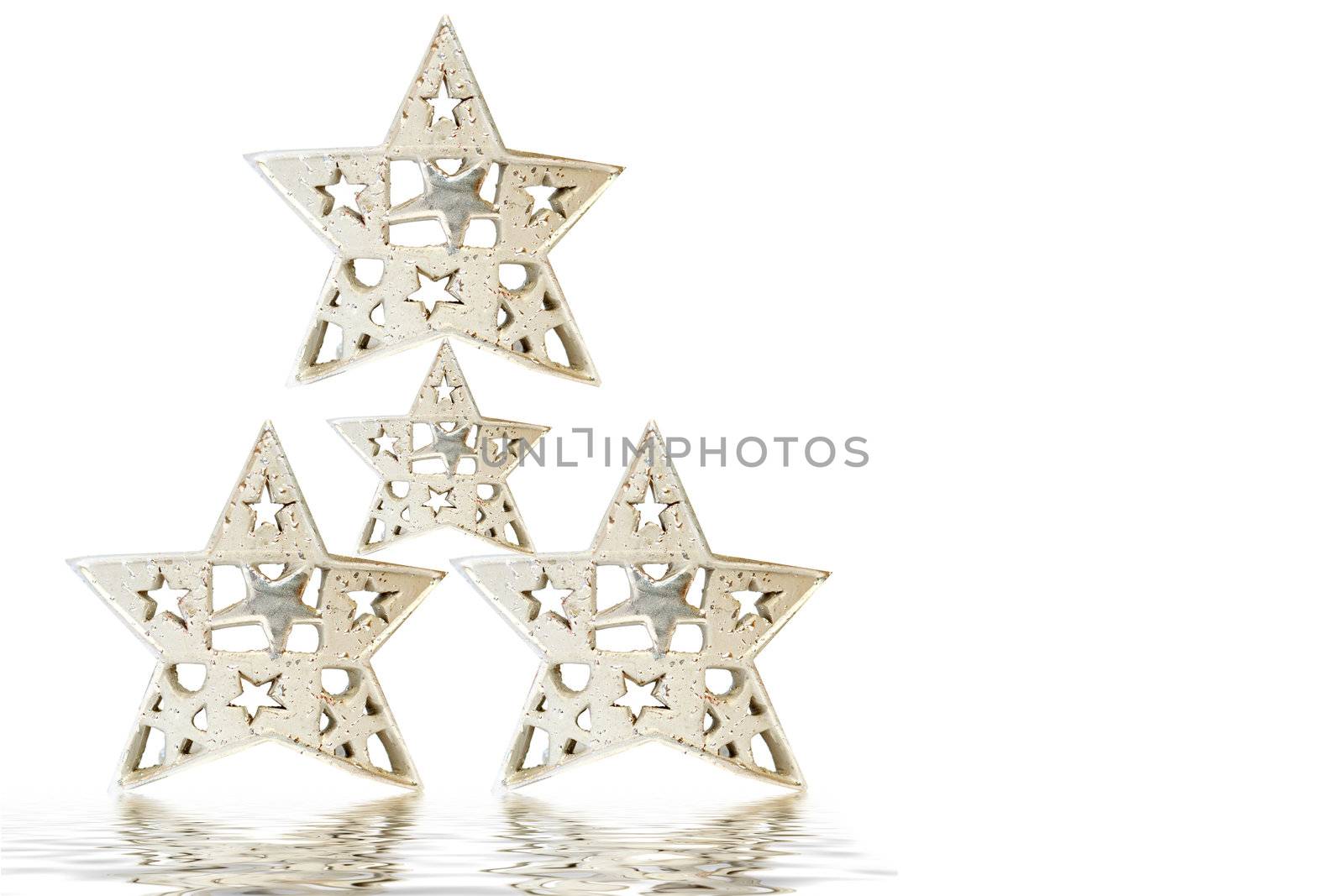 Christmas tree made up of four silver stars on white background