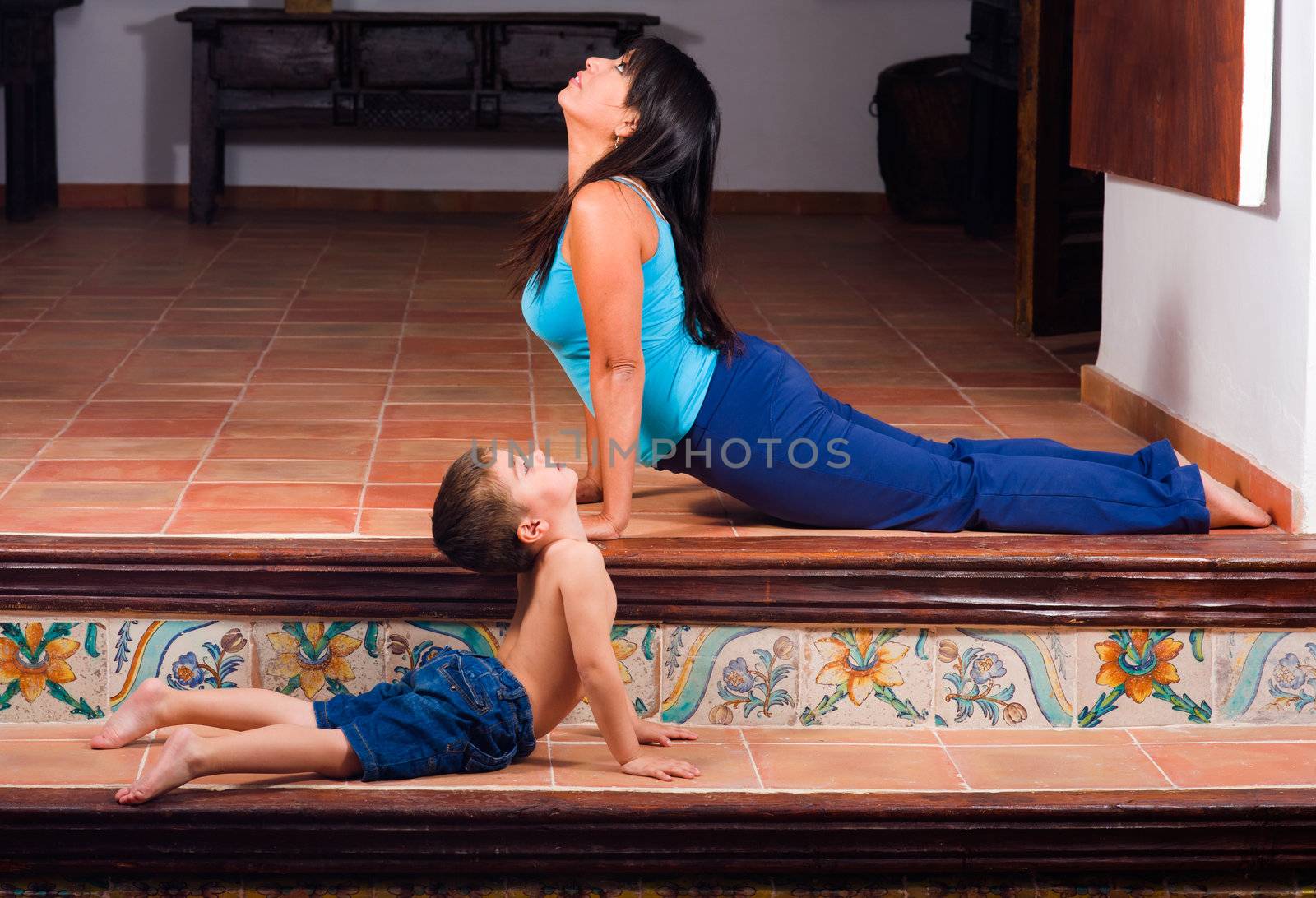 Mother and son doing yoga exercises together
