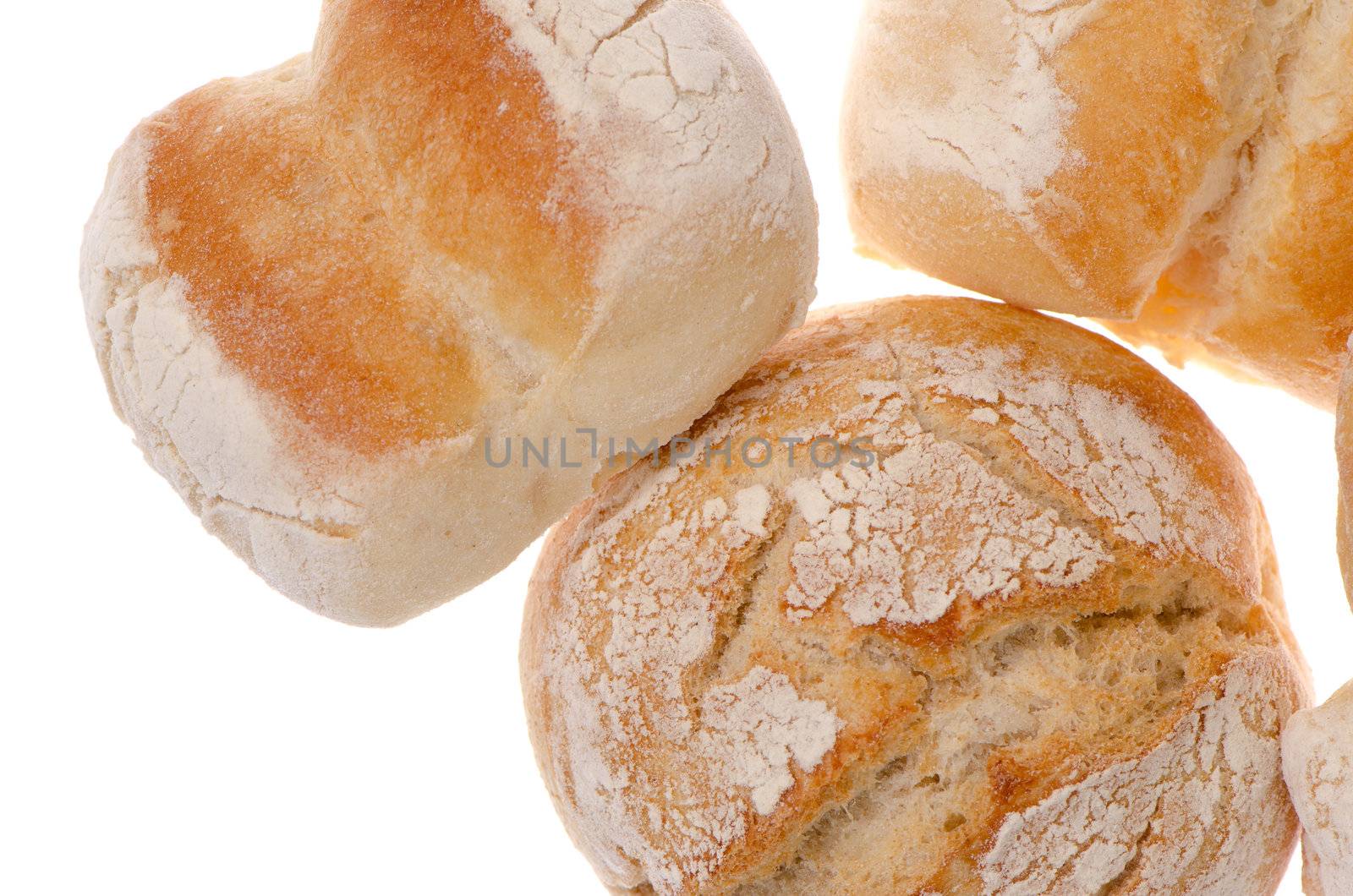 Bread closeup on top of wooden table background.