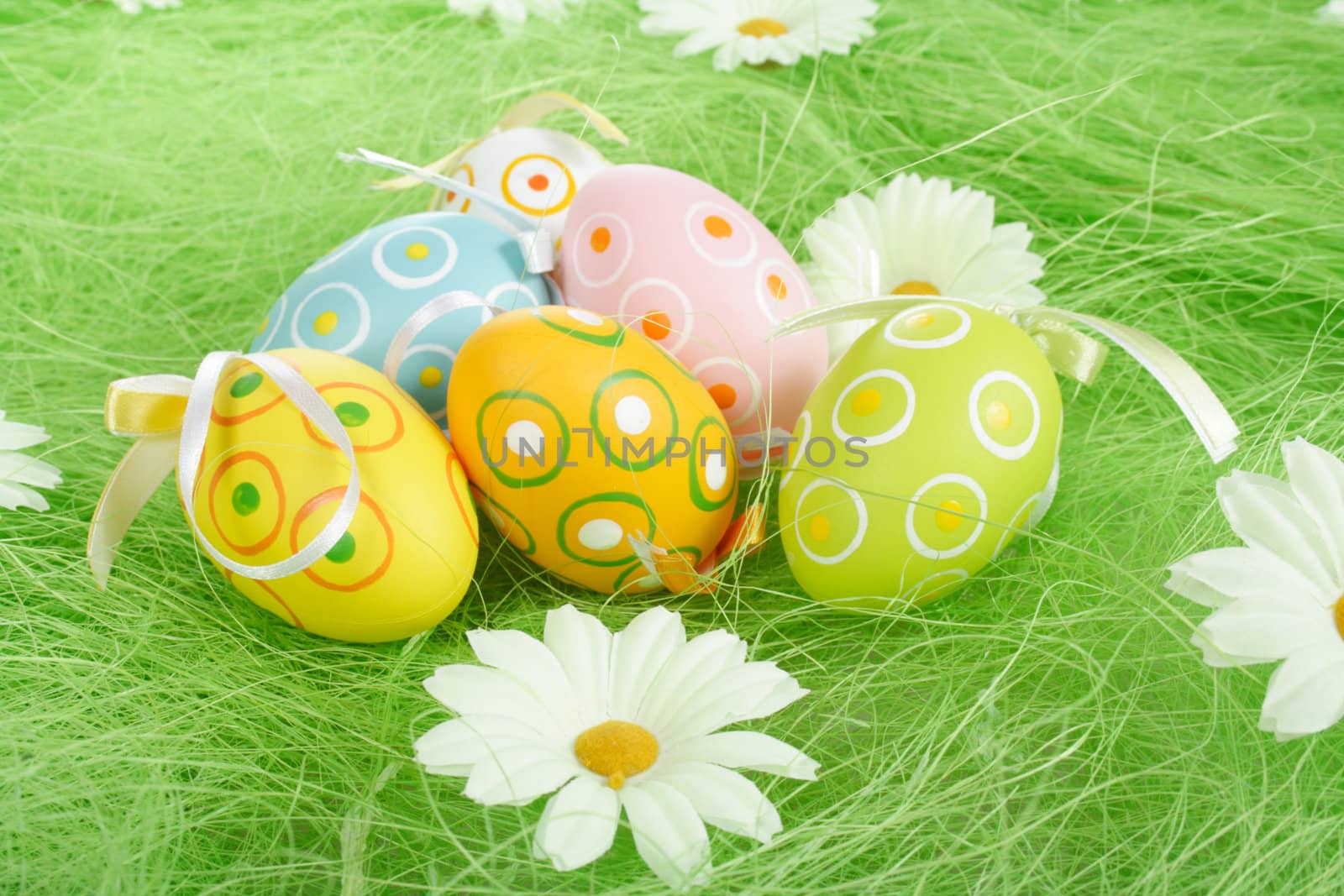 Painted Colorful Easter Eggs on green Grass