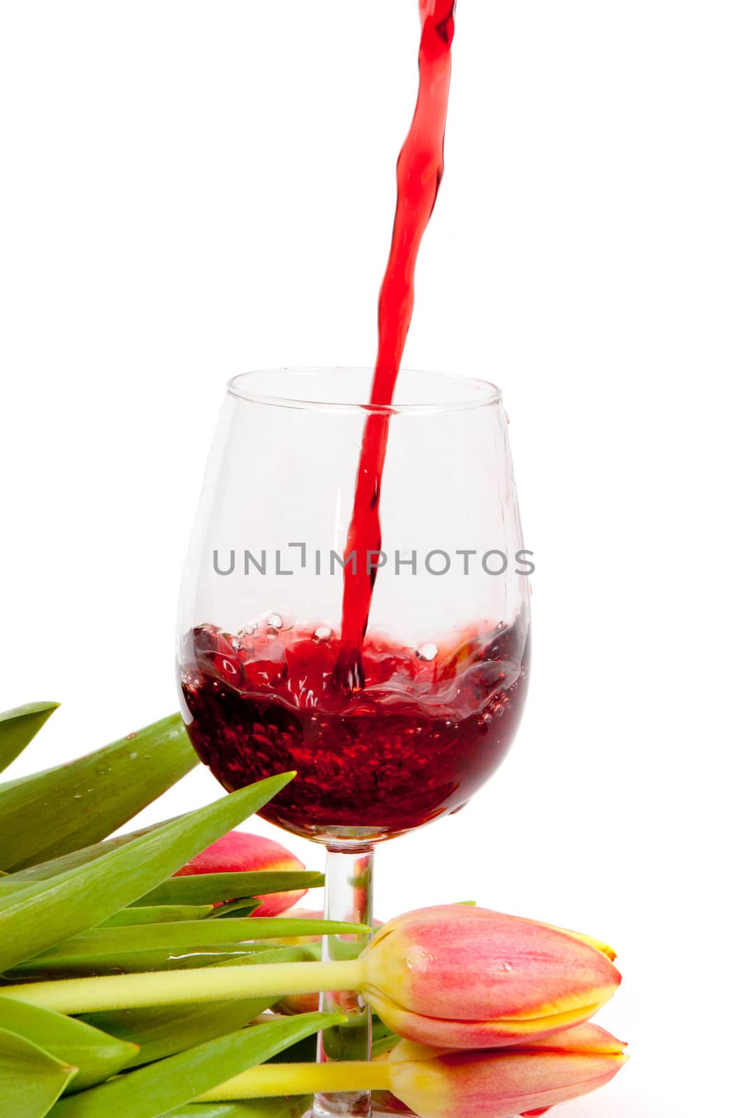 Red wine pouring into wine glass  by ladyminnie