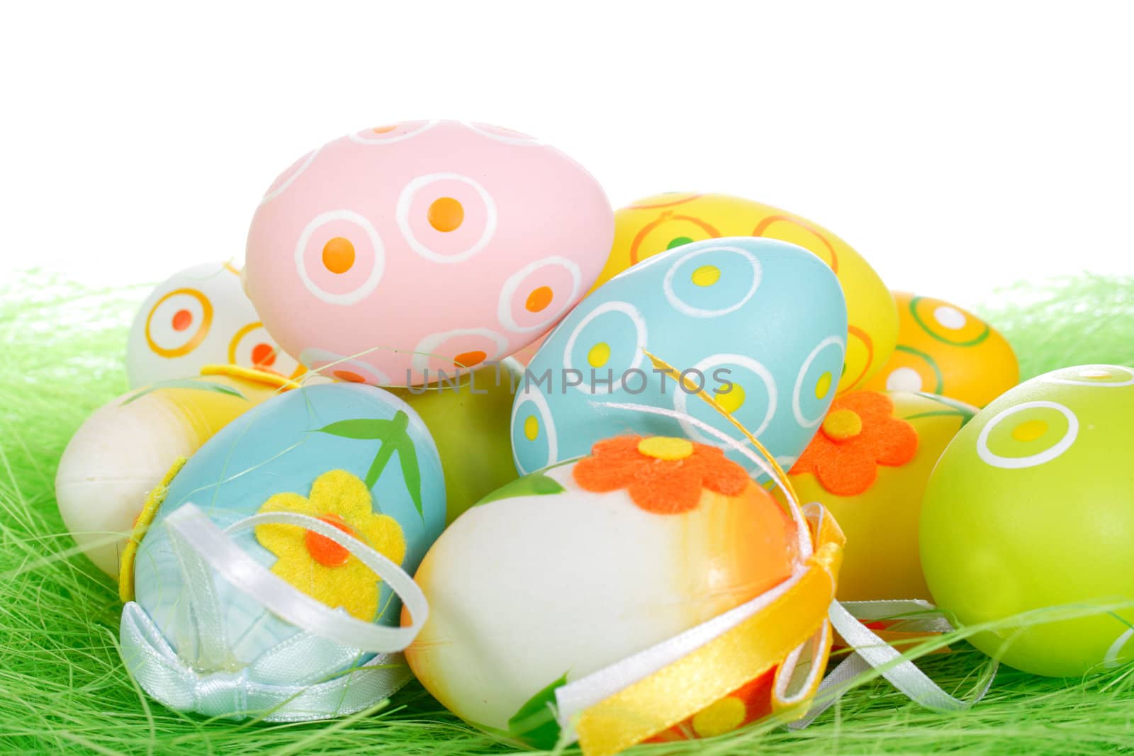 Painted Colorful Easter Eggs on green Grass