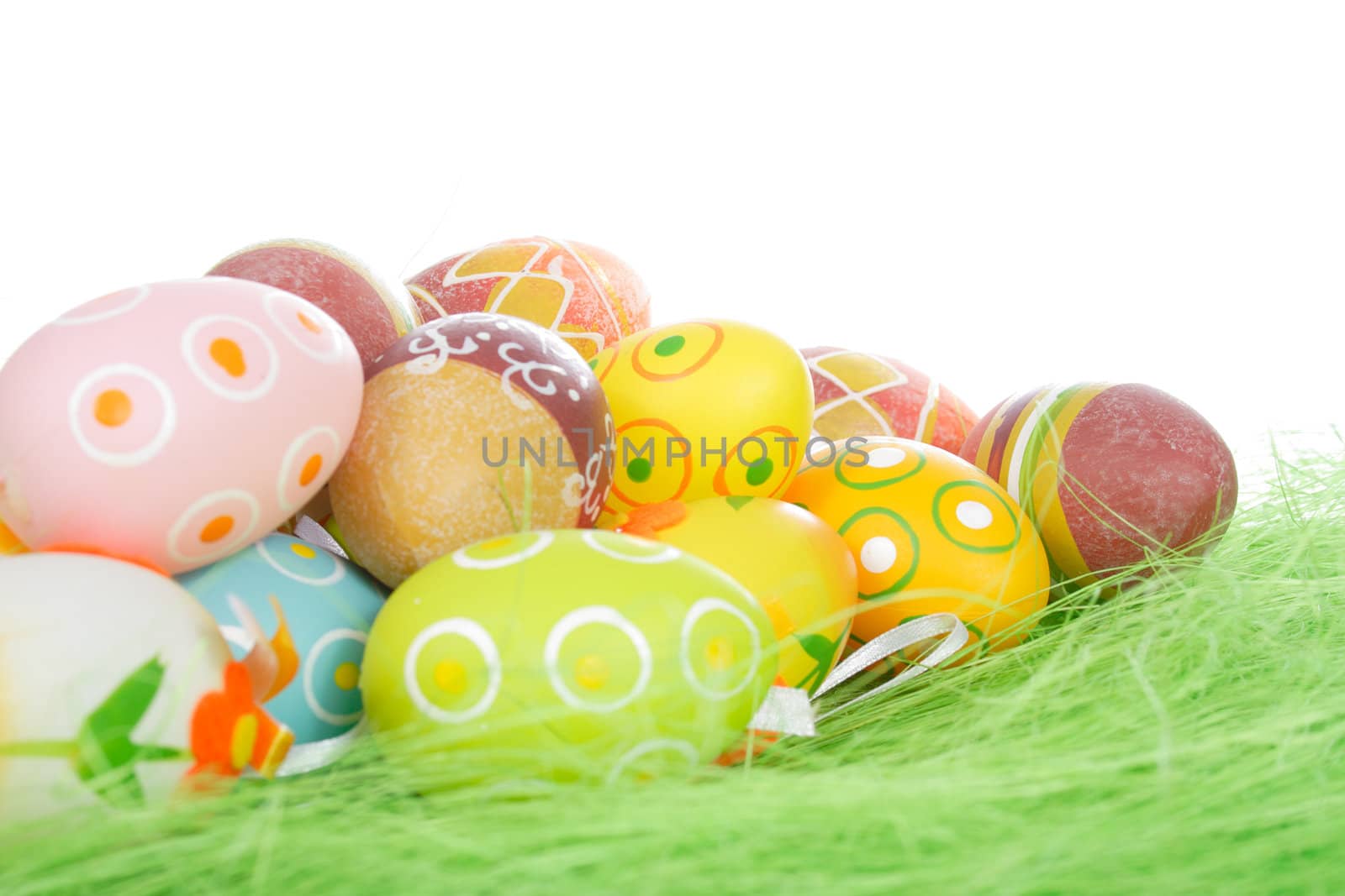 Painted Colorful Easter Eggs on green Grass