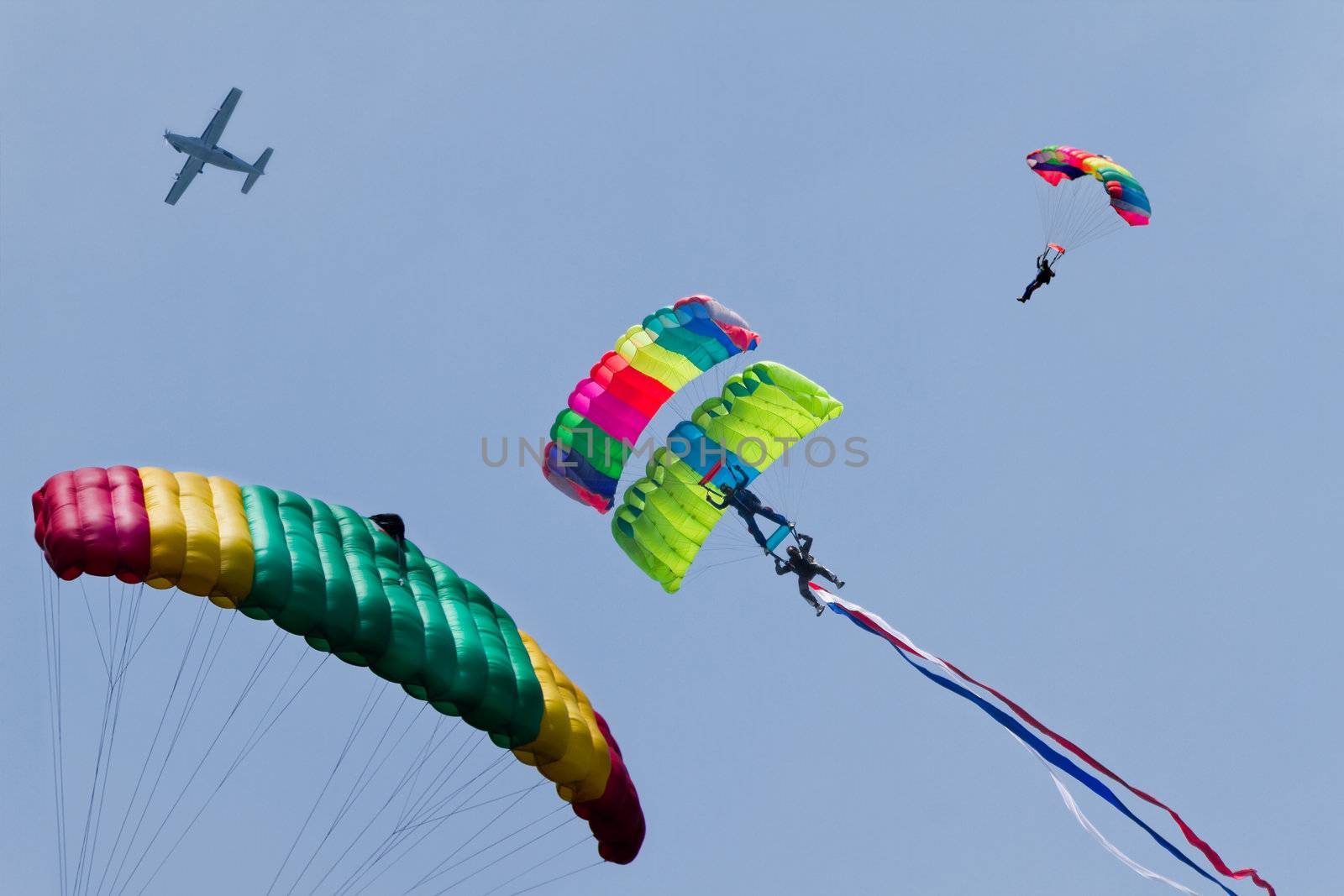 Skydiving - Parachutists demonstrate jumping from airplane