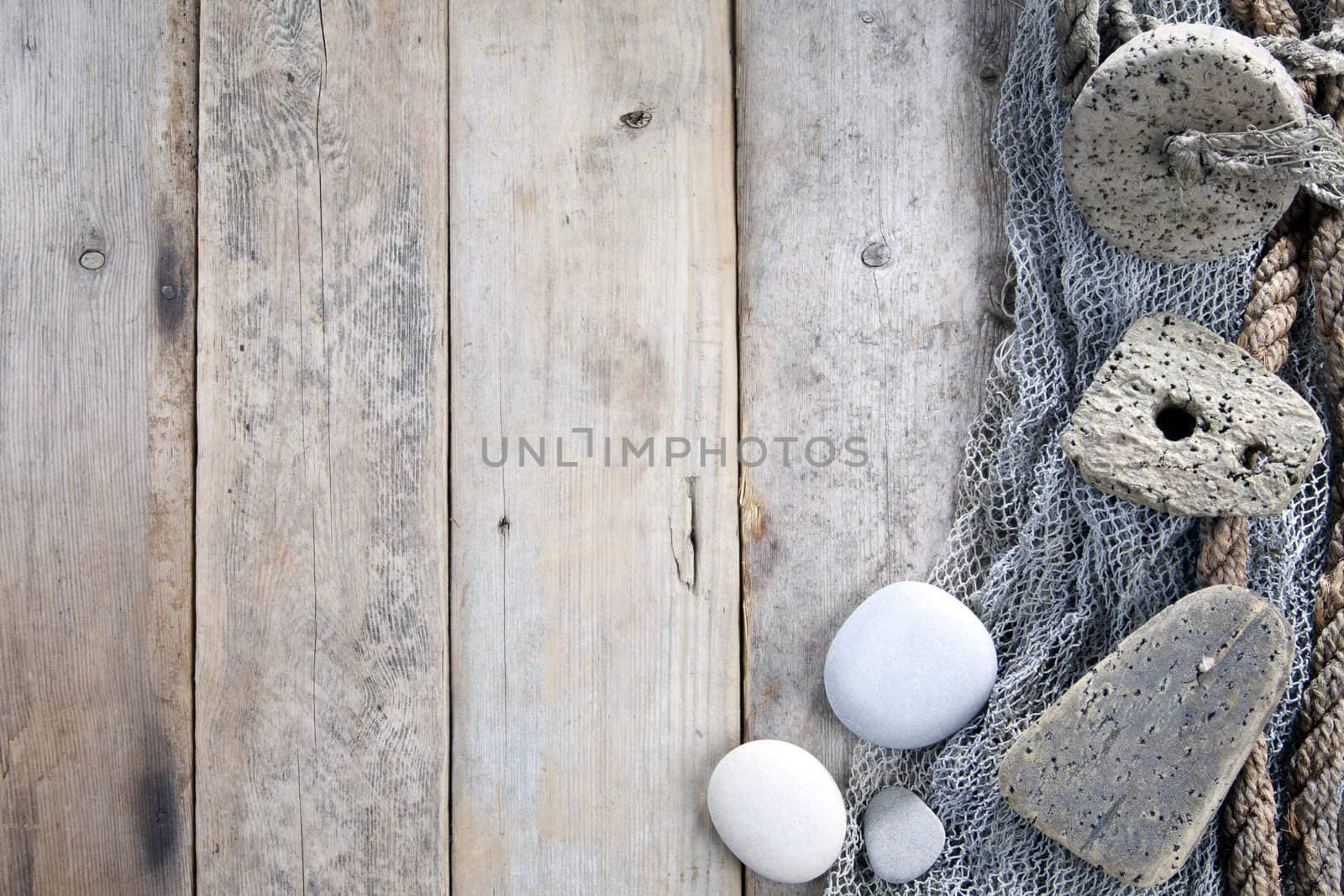 Cork, fishing net and rope with wooden background