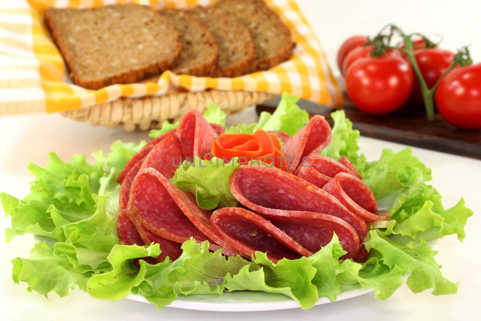 a plate of salami and garnish