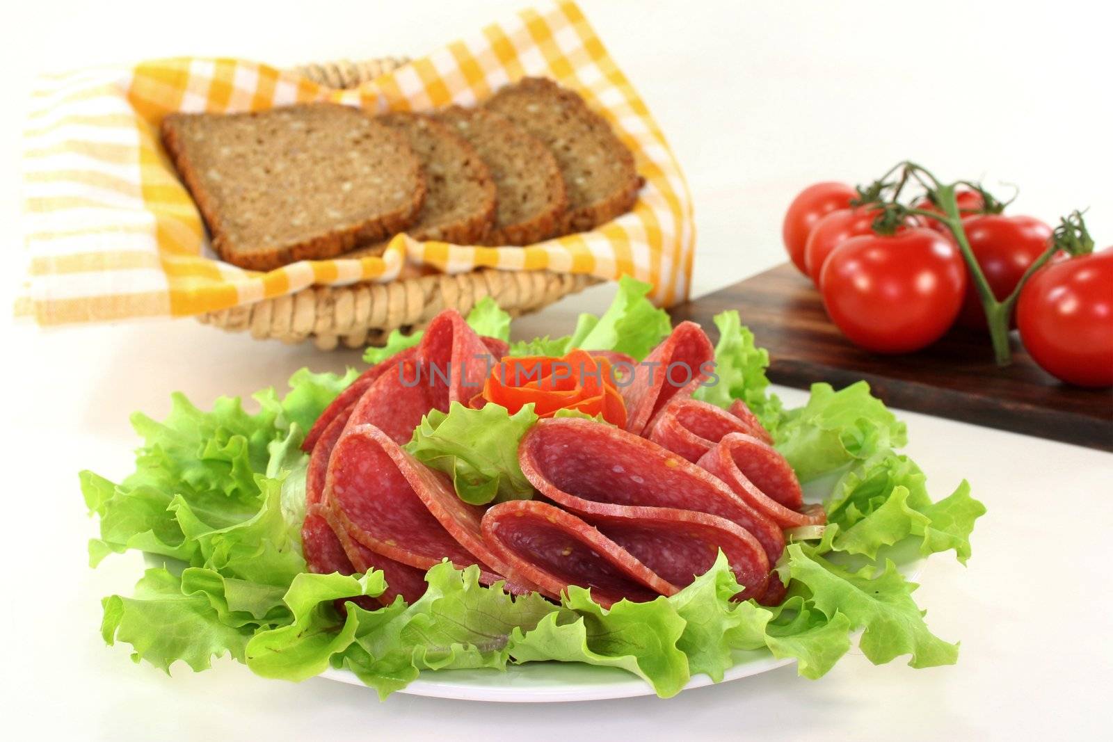 a plate of salami and garnish
