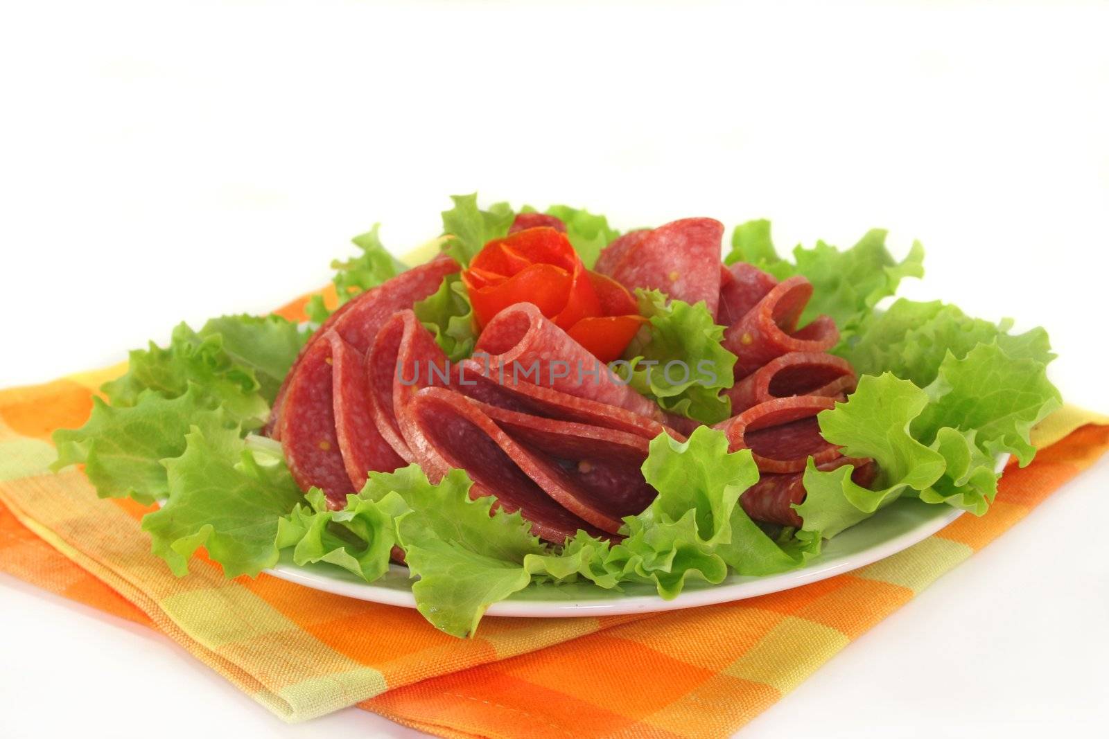 a plate of salami and garnish