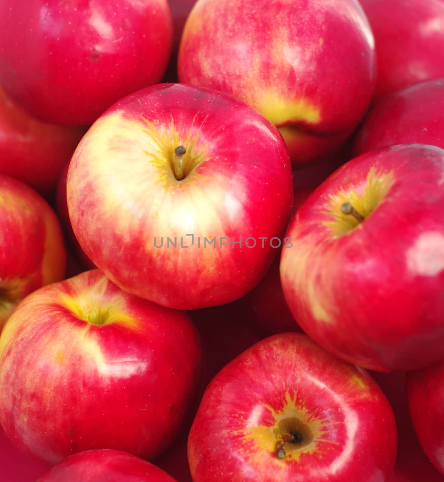 fruits many cumulate red apples as background 