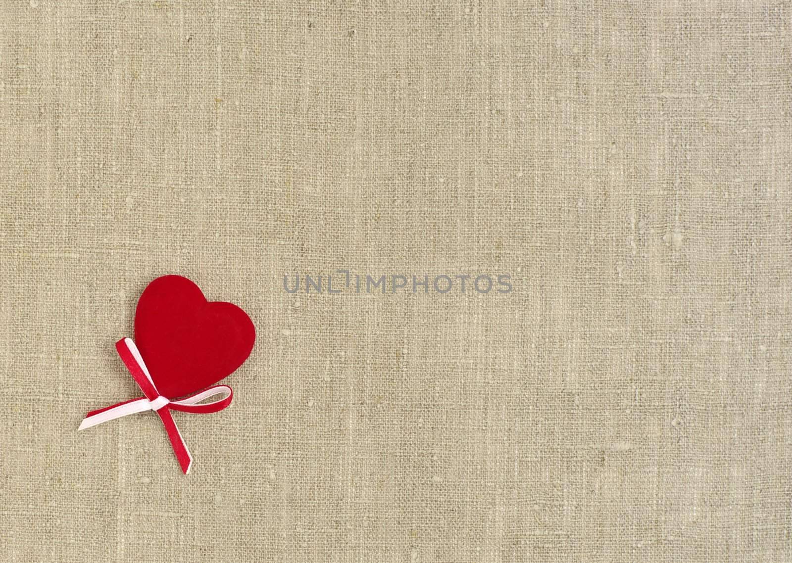 red heart with bow on bagging  texture background  