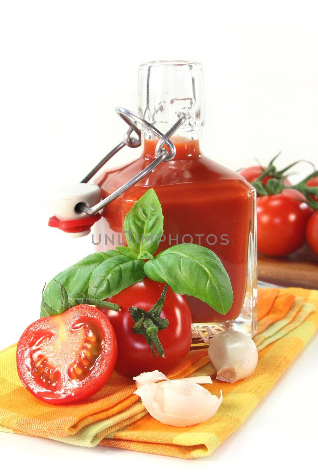 a bottle of tomato ketchup with fresh ingredients