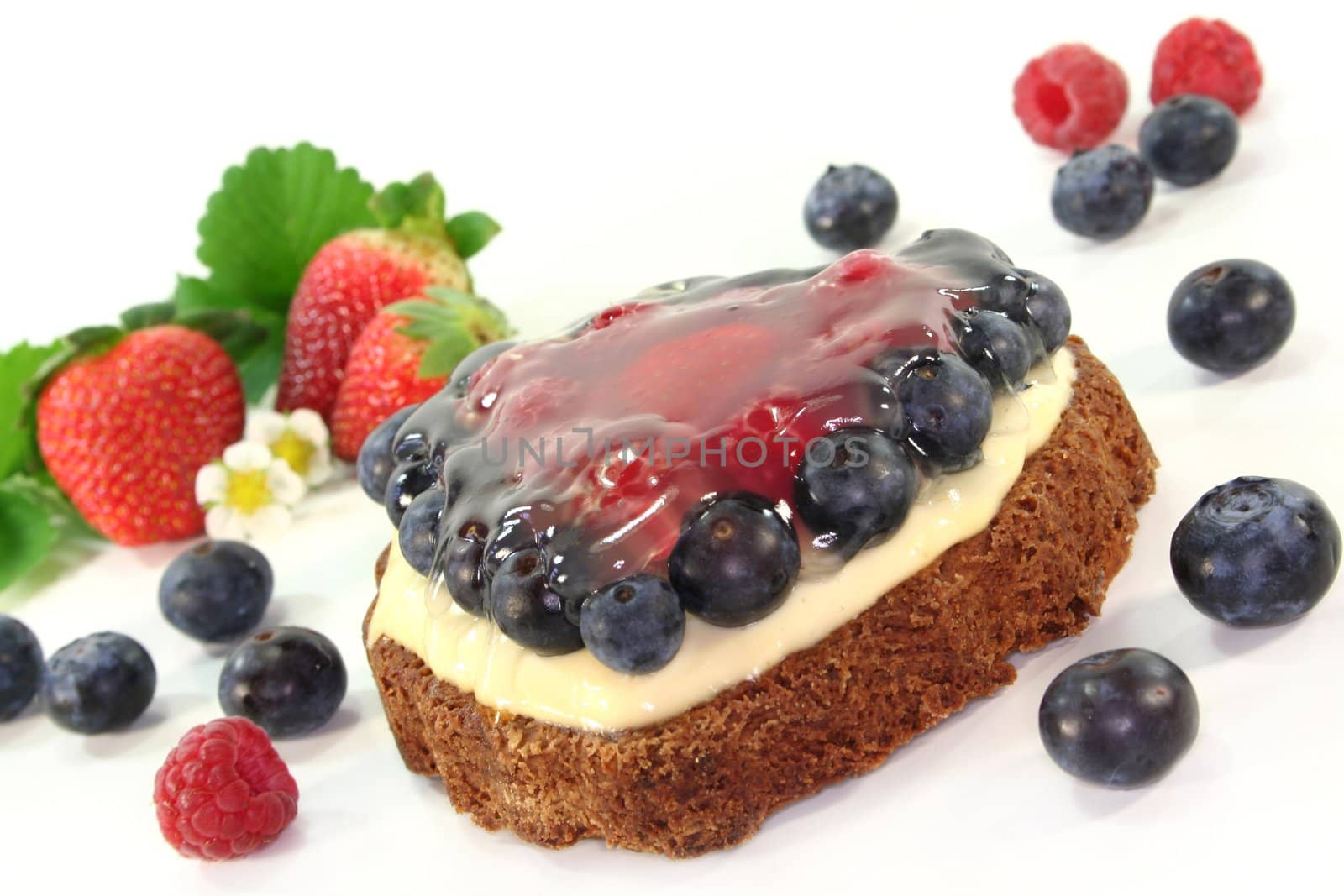 a forest fruit tarts with different berries
