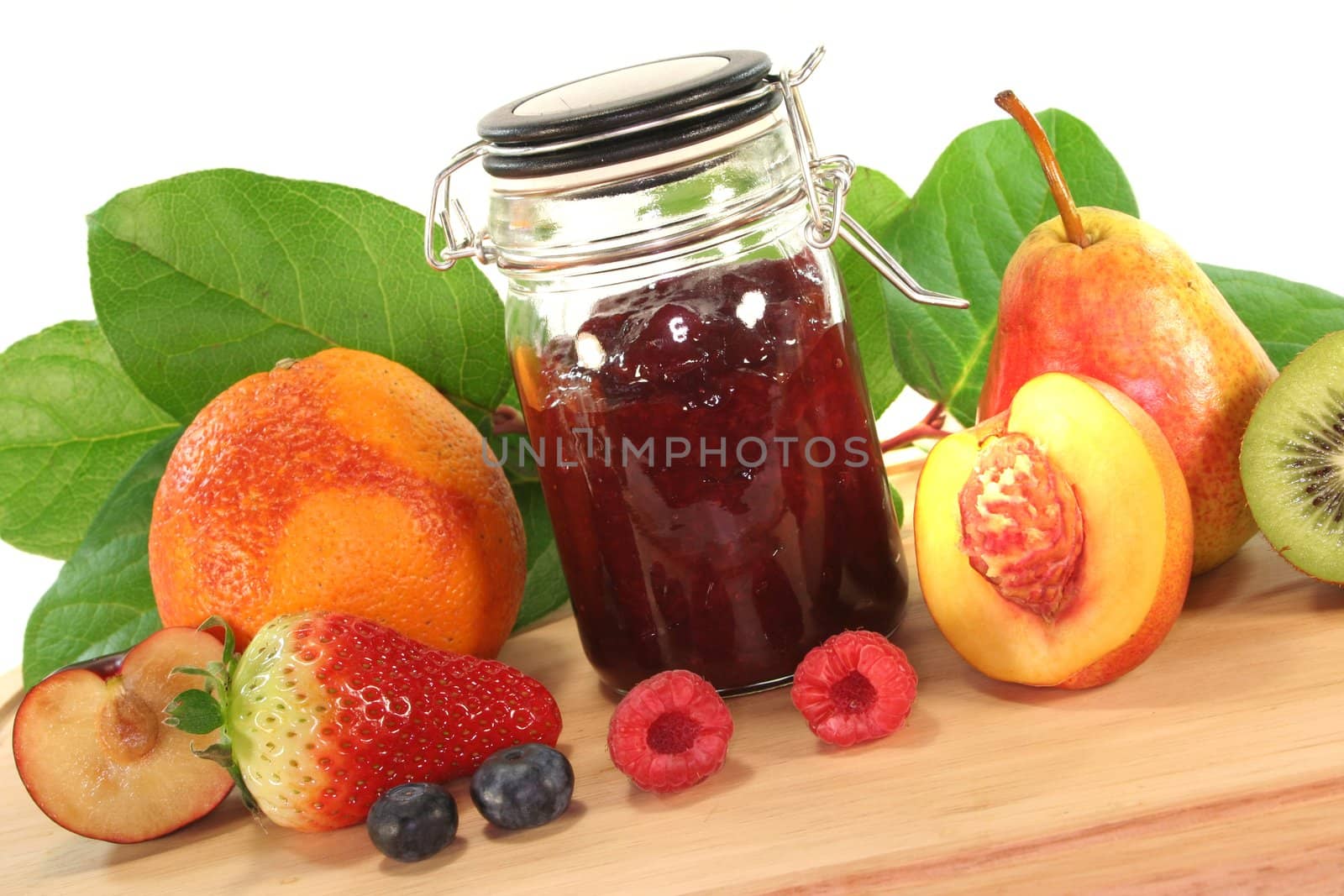 Fruit marmalade with different fruits on a wooden board