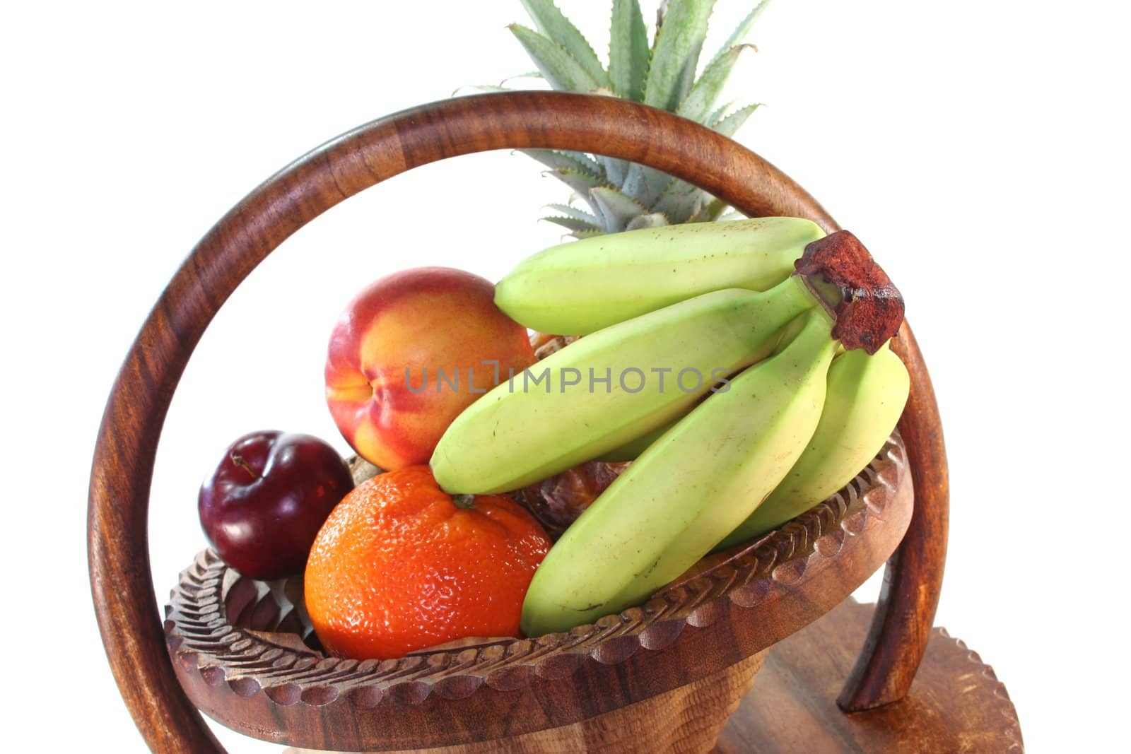 Mix of native and exotic fruits in a wooden basket