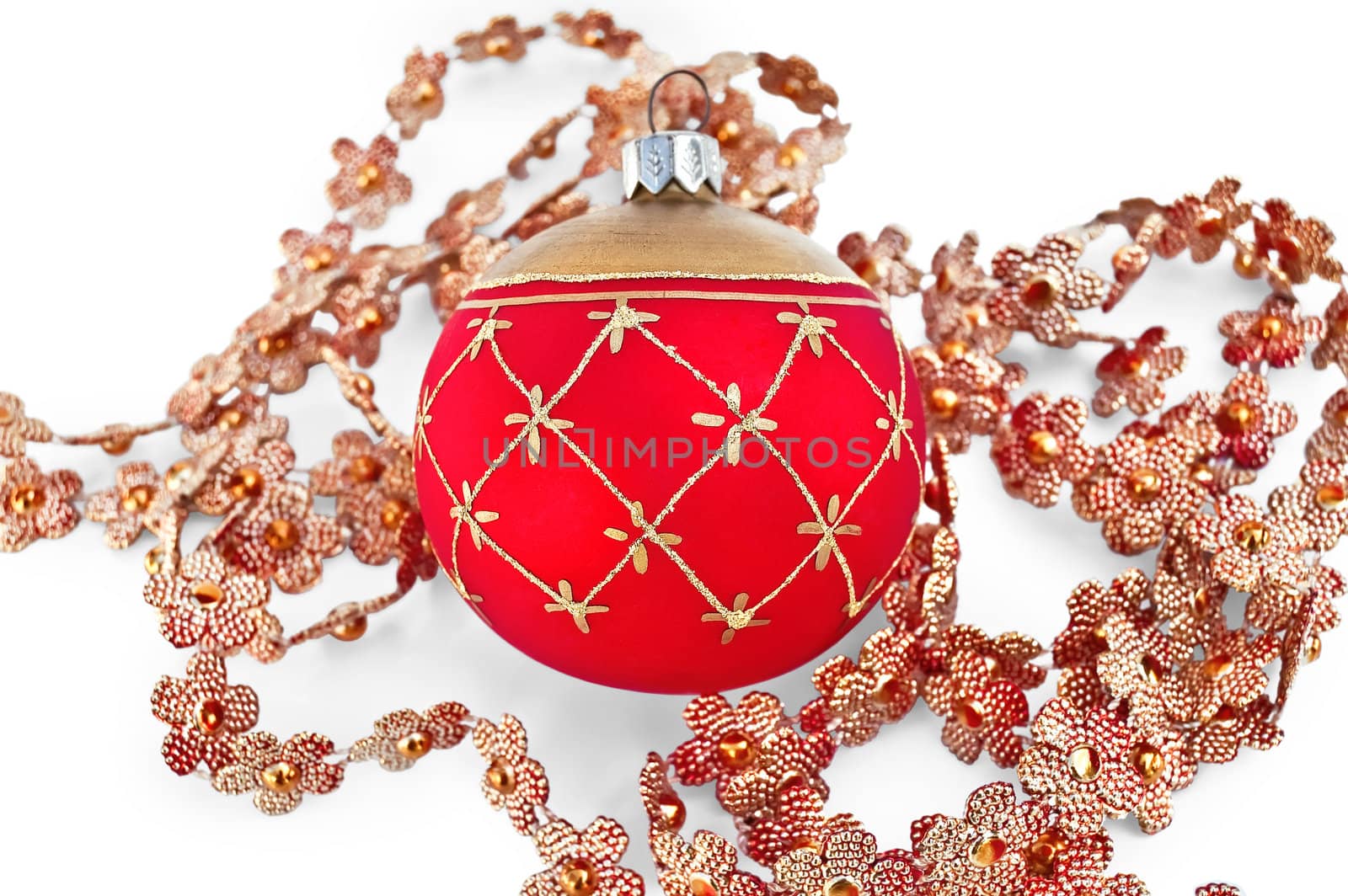Christmas red ball with golden ornaments, shiny Christmas tree pendants in the shape of flowers isolated on white background