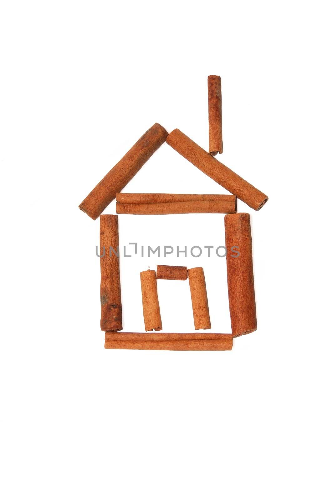 House of cinnamon sticks on a white background