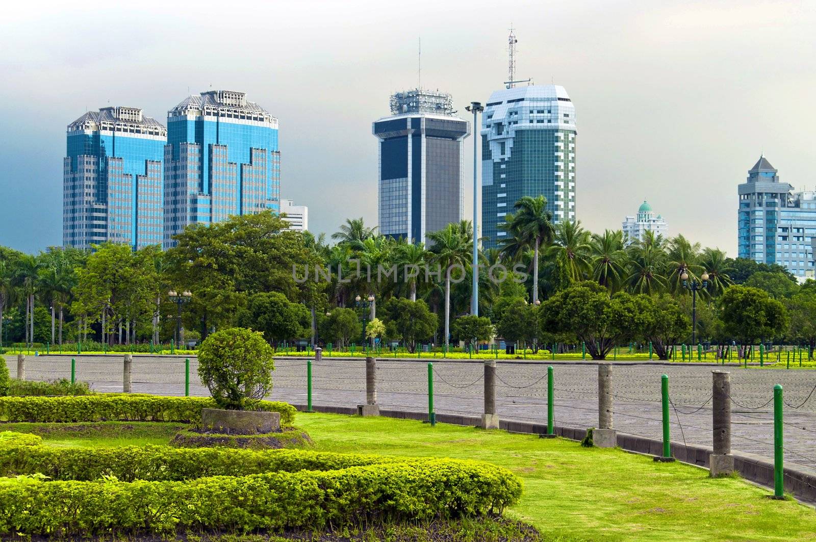 Jakarta skyline in public park garden in bad weather