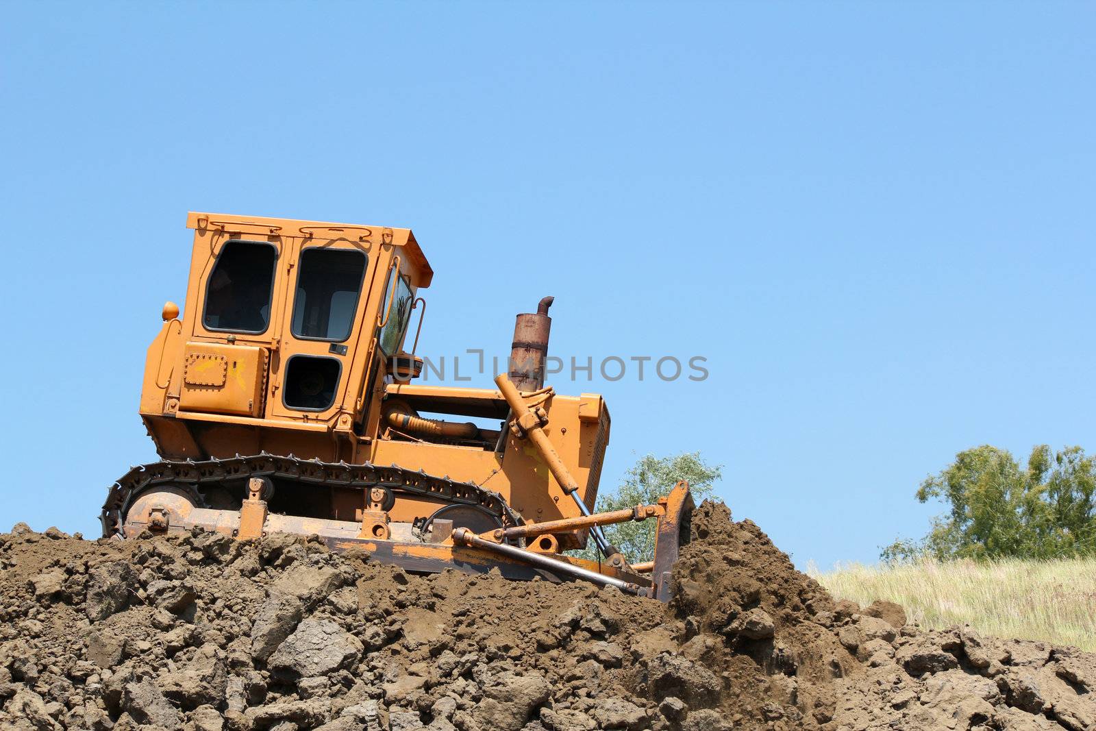 bulldozer on road construction by goce