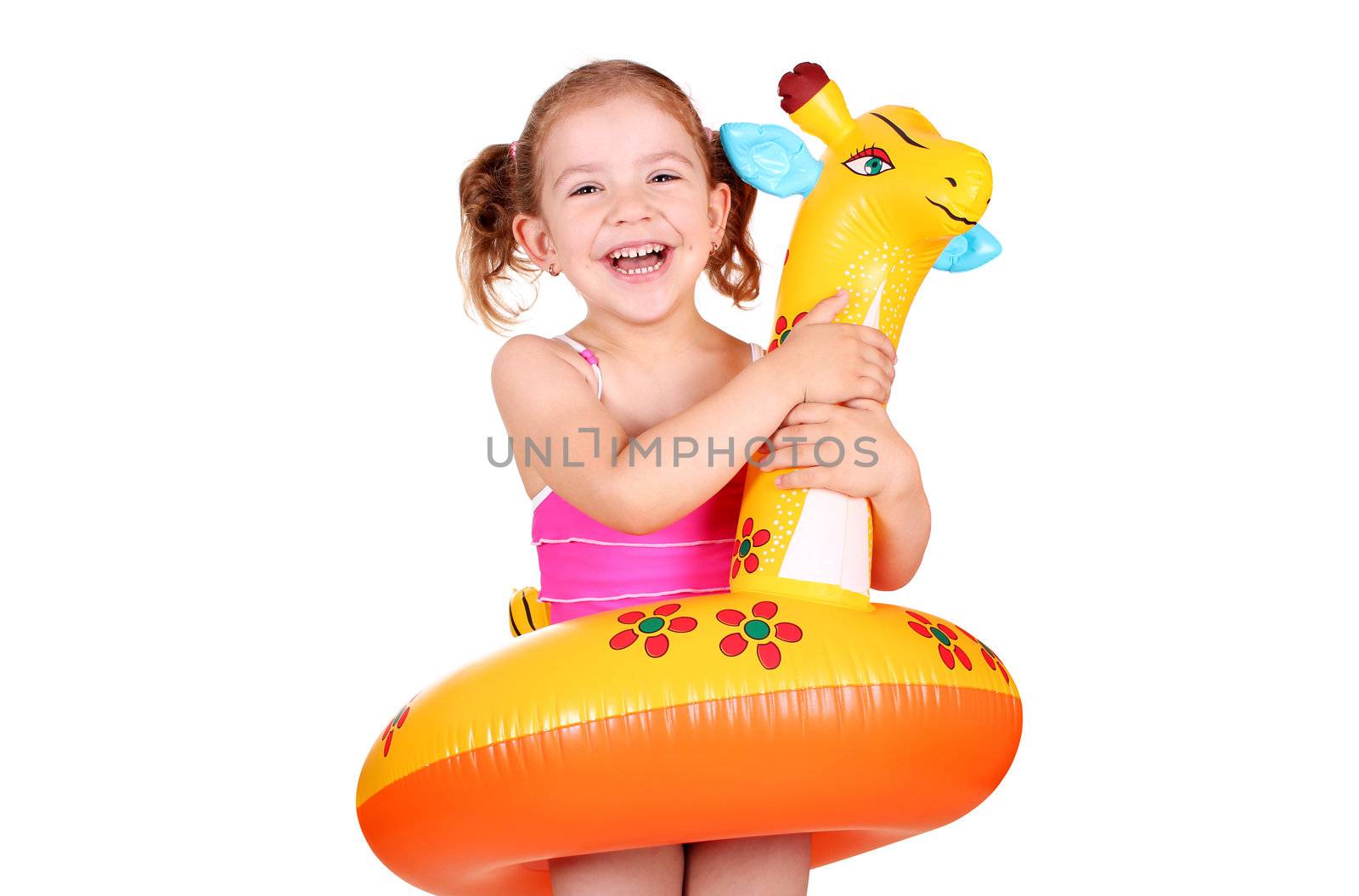 happy little girl with inflatable rubber ready for beach by goce