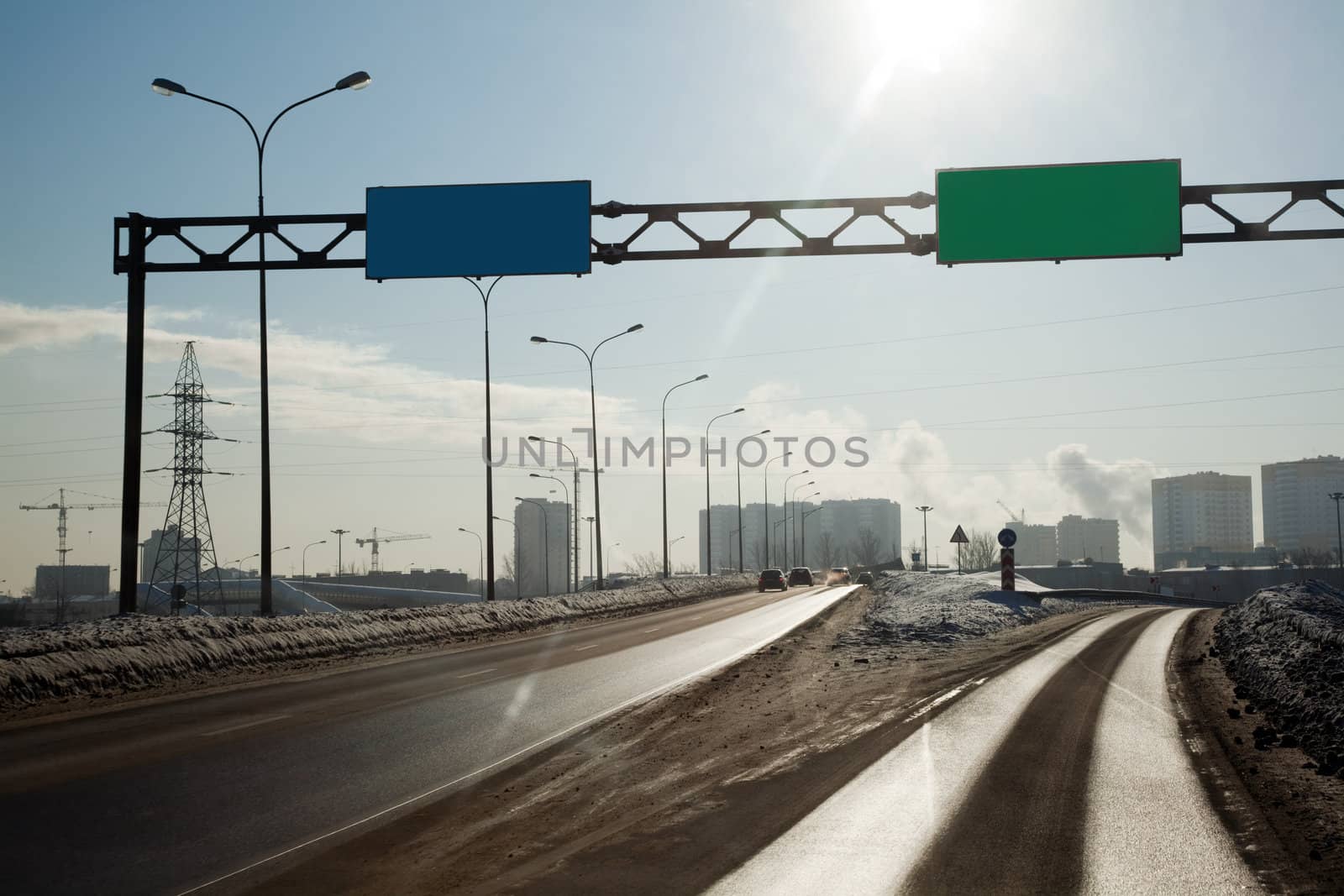 The road to the entrance to the metropolis. View through the car window.