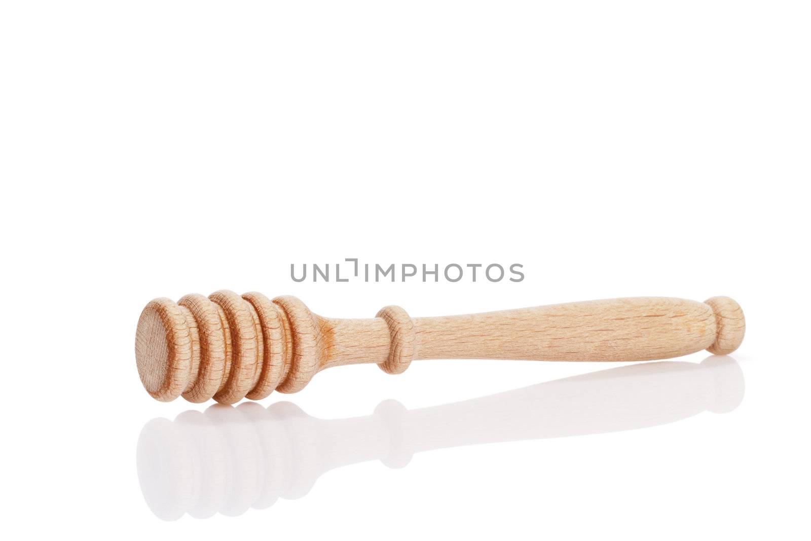 honey dipper with reflection on white background