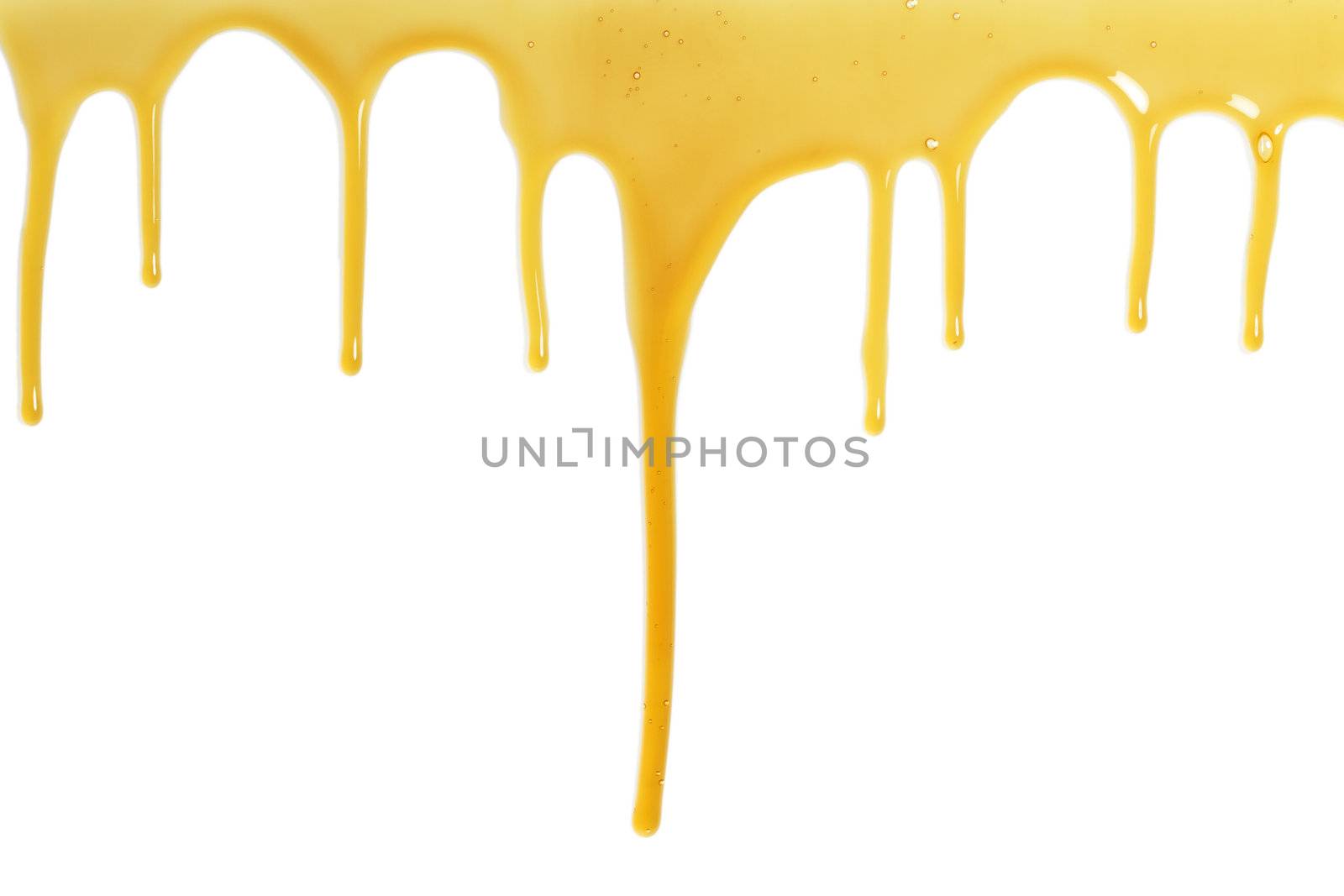 sweet and sticky honey flows over a white background