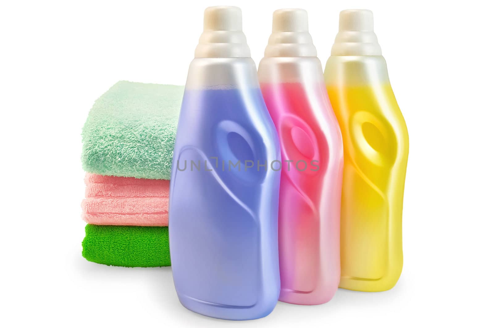Three bottles of fabric softener pink, yellow and lilac, three of towels isolated on white background