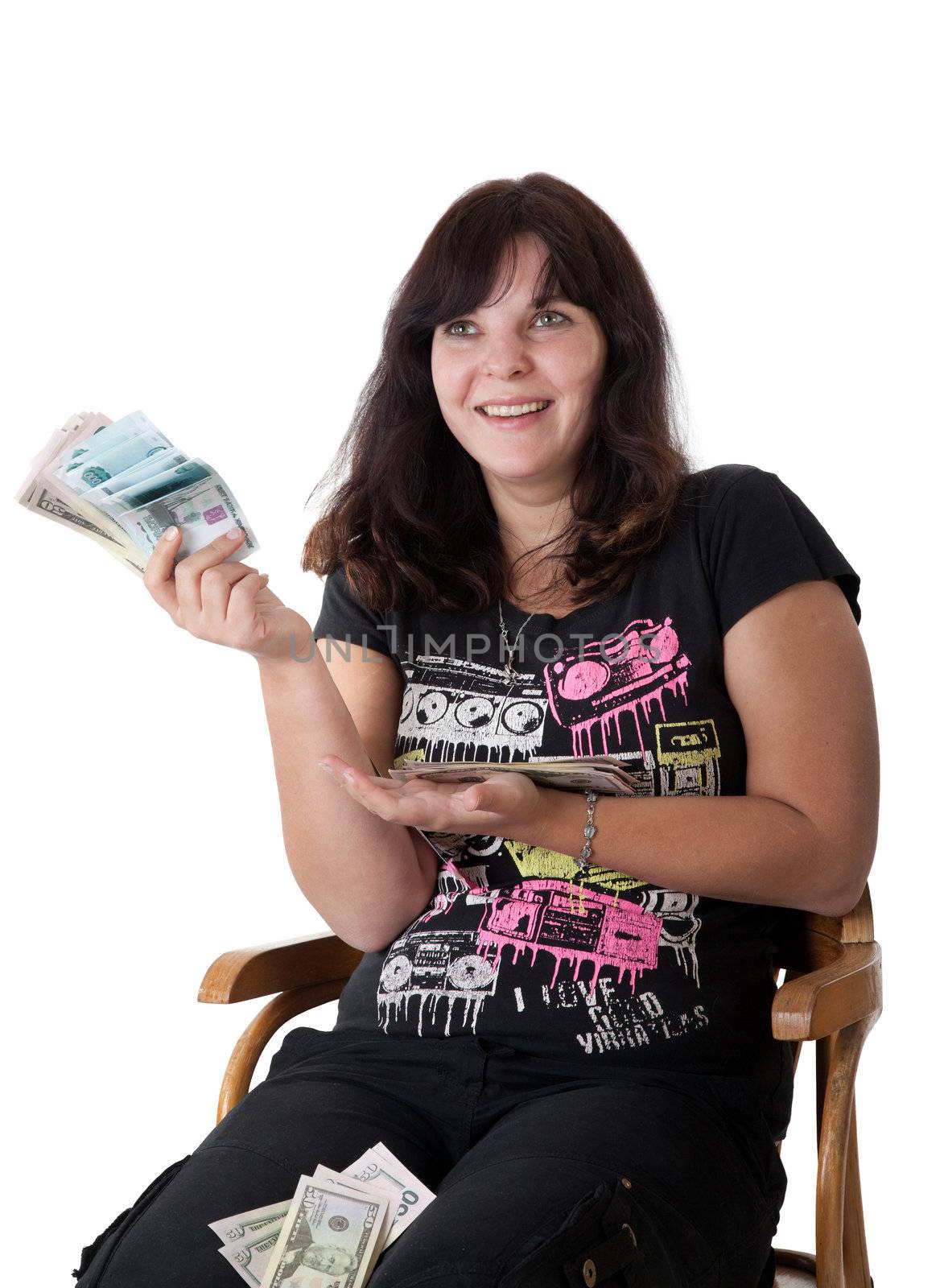 Happy young girl holding a lot of money. Isolated on white background