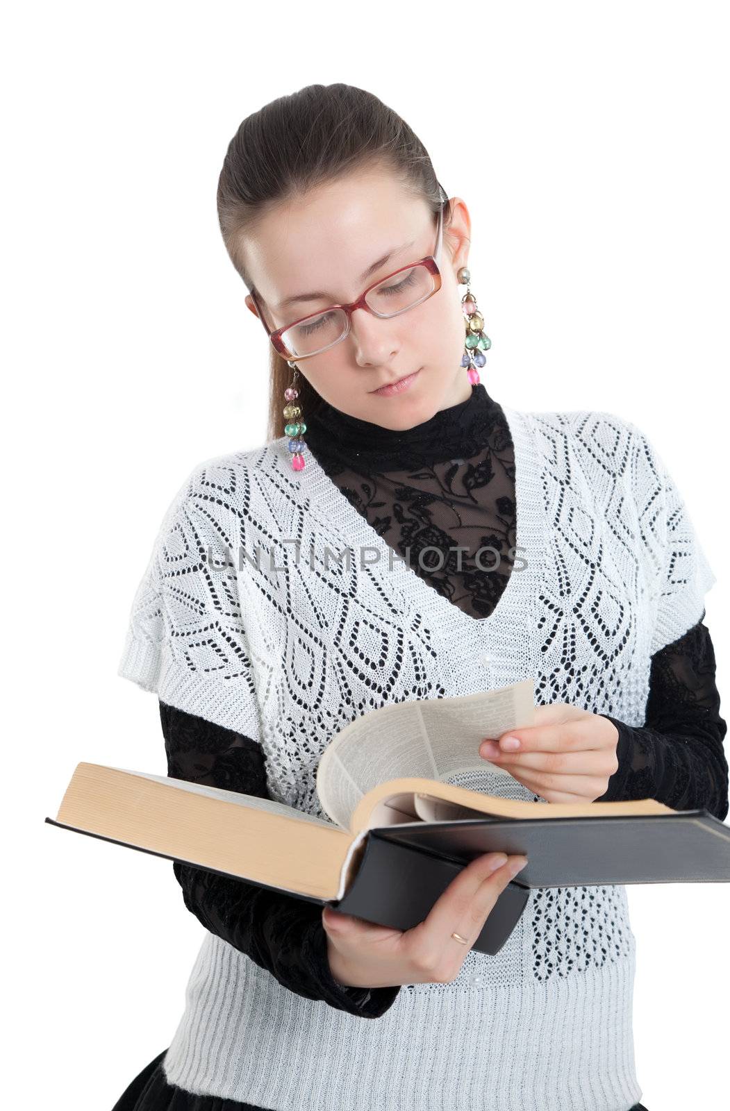 Girl with glasses reading a book.  Isolated on white background