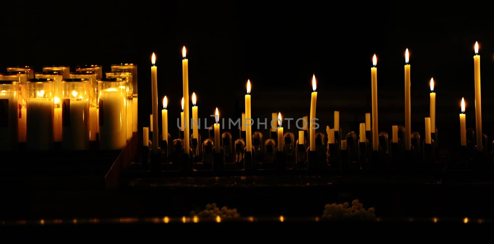 Burning Candles Before The Altar In The Church