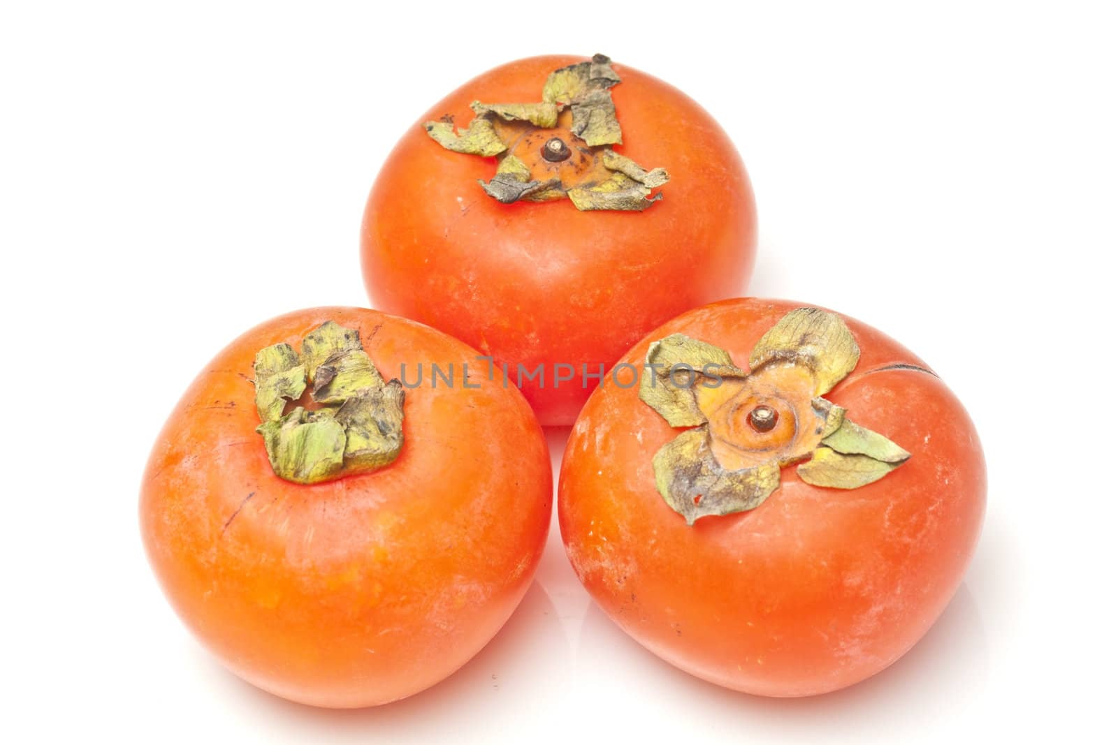 Persimmons isolated on white background by kawing921