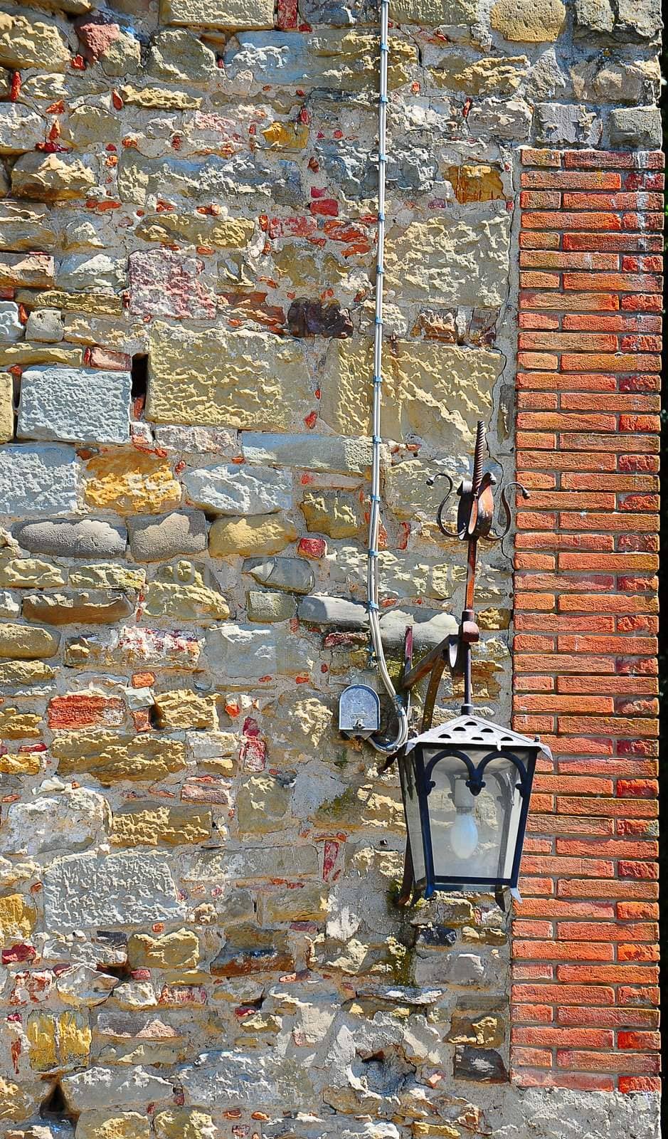 Old Glass Lamp Against The Stone Wall