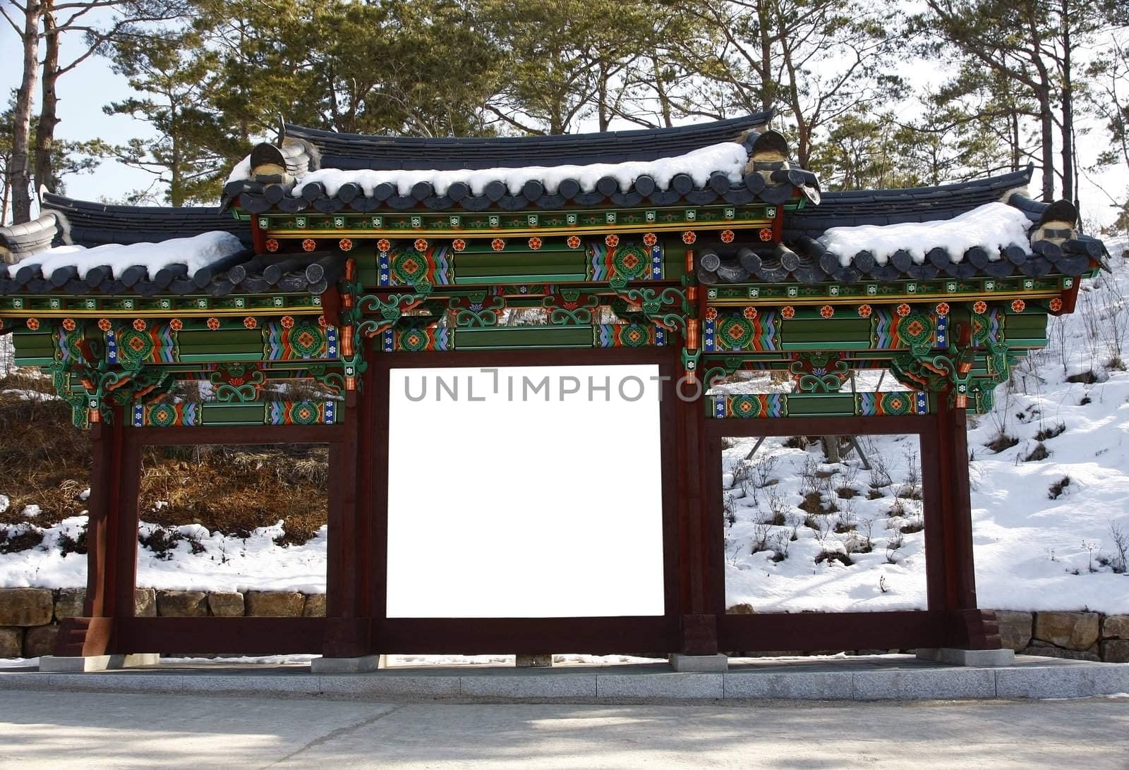 Blank billboard on a korean gate temple during winter-put your text on white.