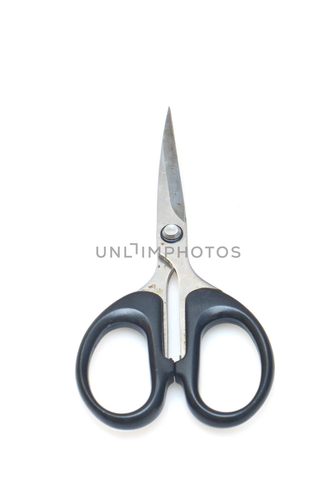 Rusted scissors isolated on white background