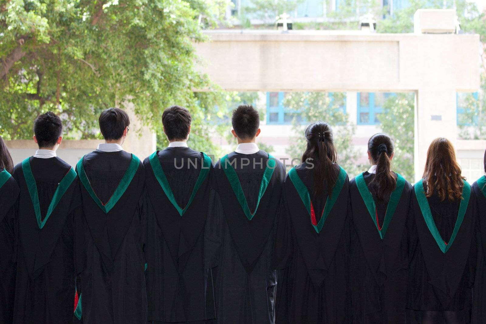 Back of university graduates with their gowns by kawing921