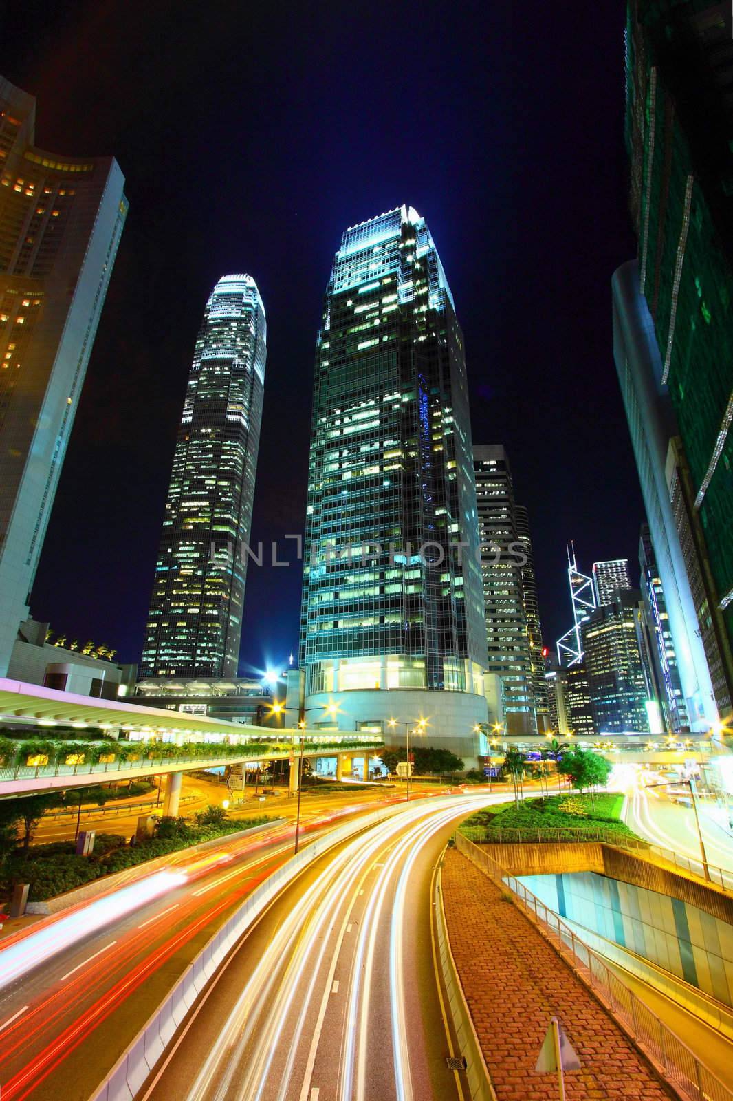 Traffic in city at night, it shows the busy business environment by kawing921