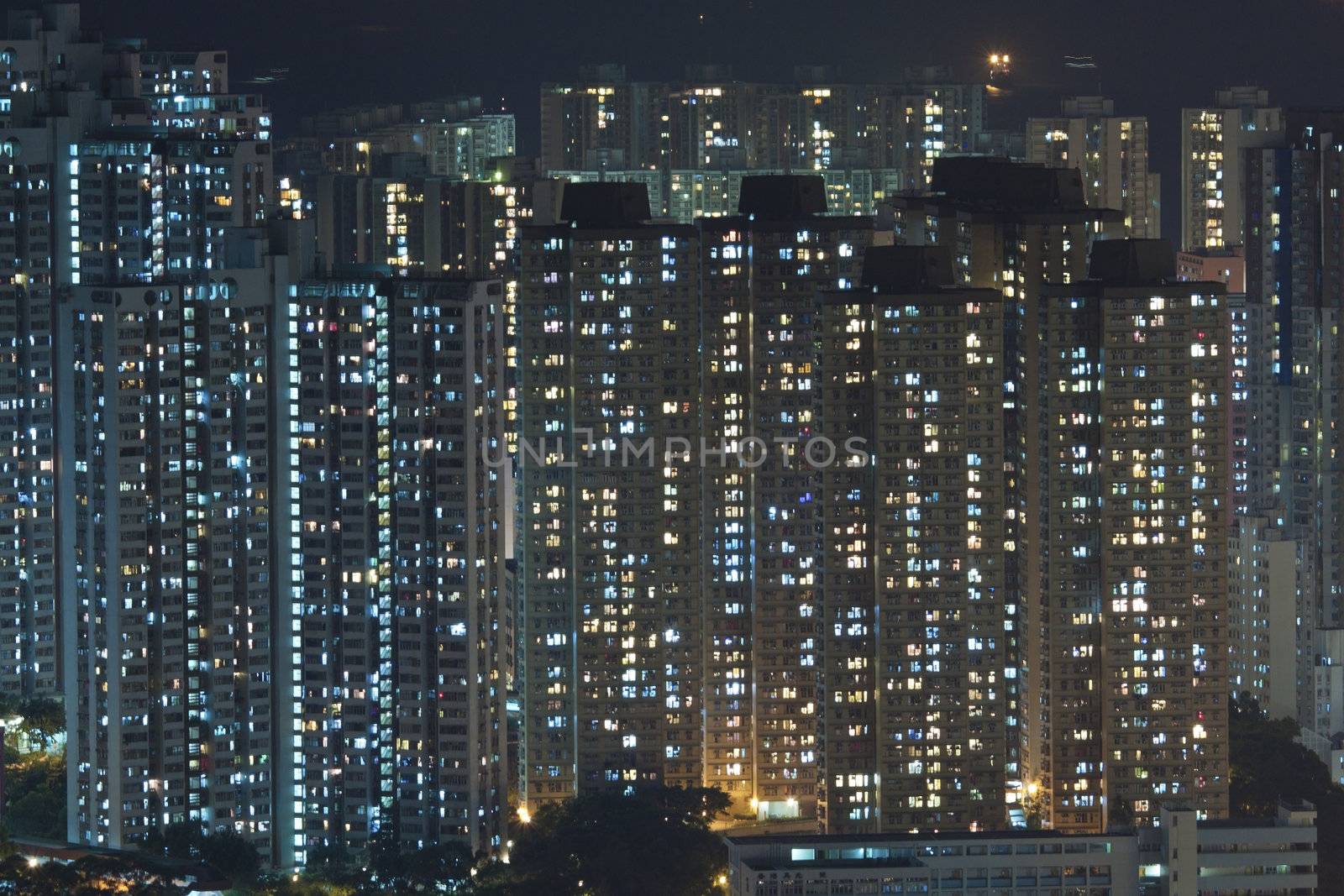 Hong Kong crowded apartments at night by kawing921