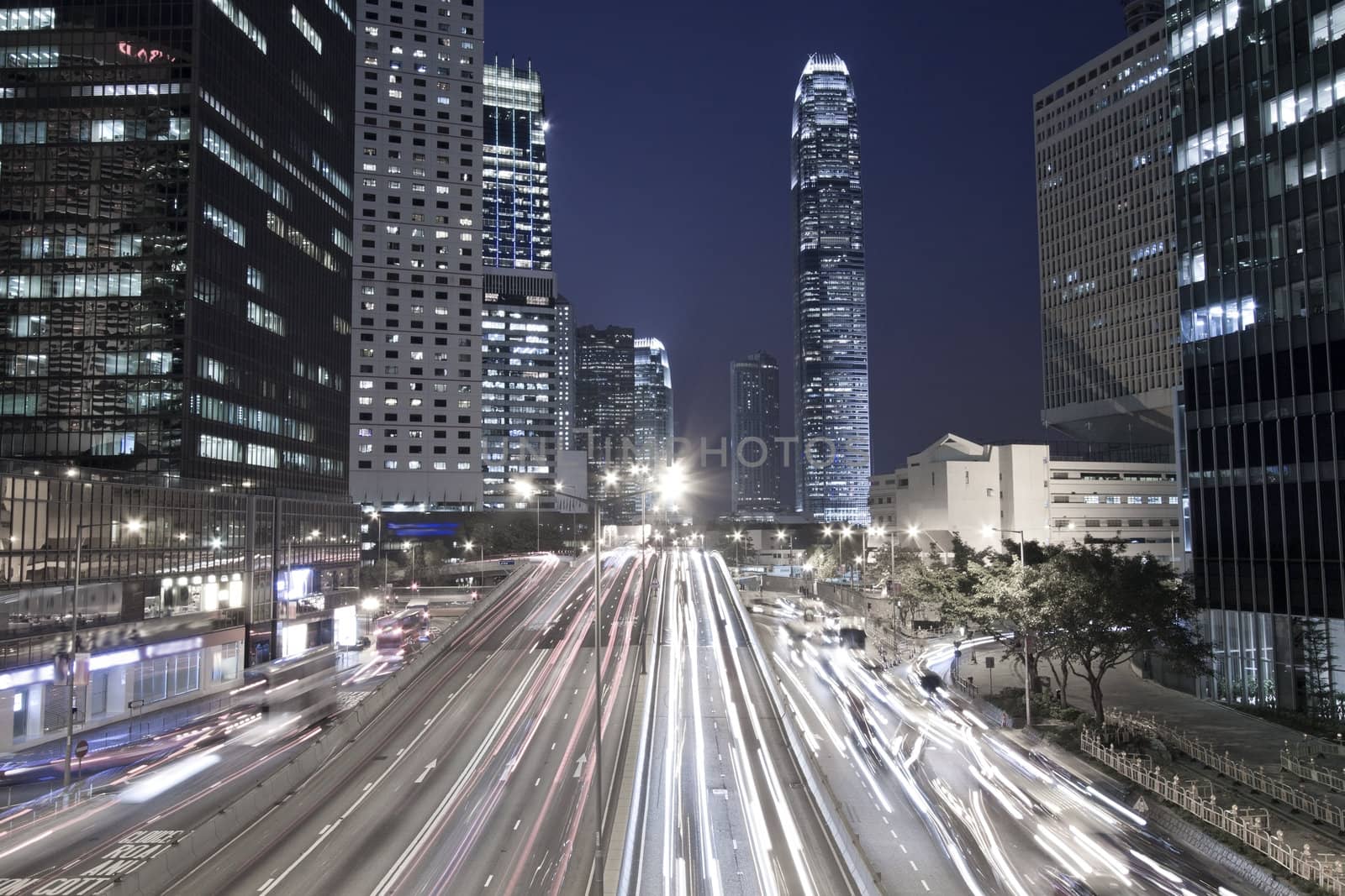 Traffic in Hong Kong downtown at night, low saturation image.