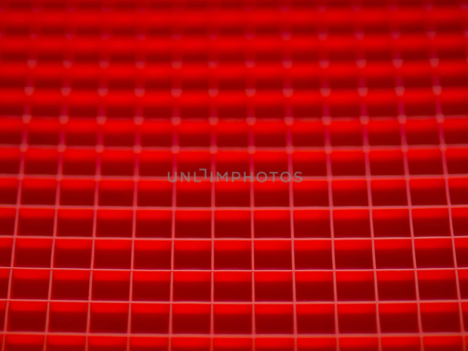 close up of red squares pattern background blurred