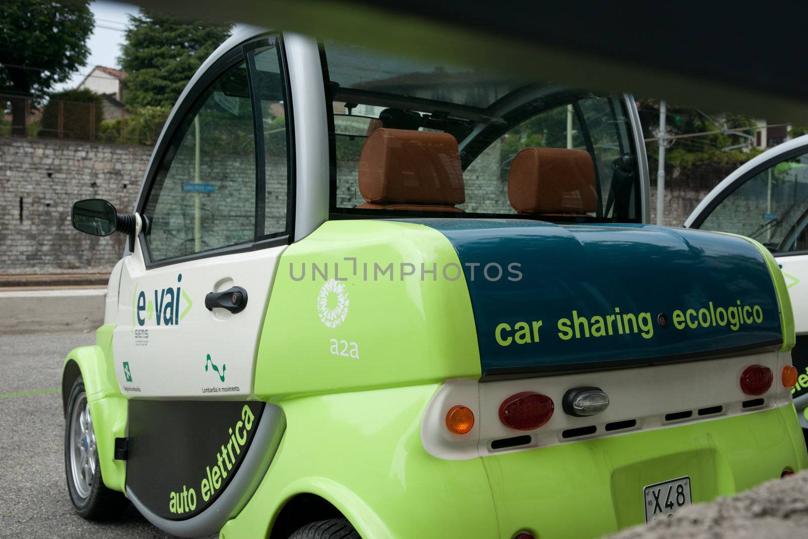 Environmental car sharing scheme in Como, Italy, compact electric cars close up.