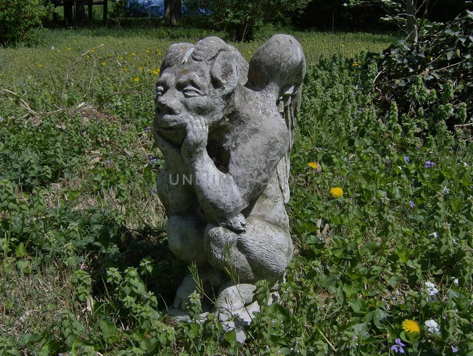 A gargoyle patiently waiting for his garden to guard