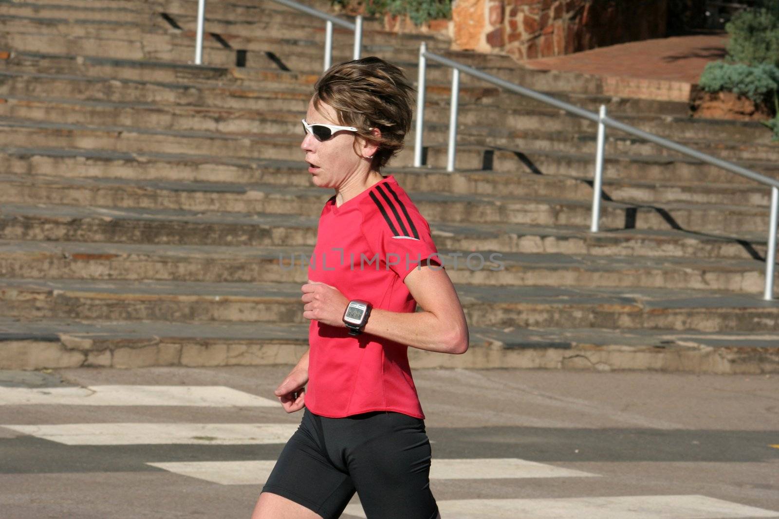 Female athlete running fast.